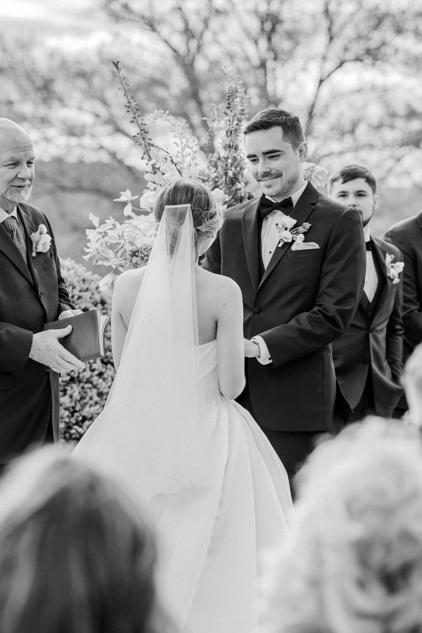 Estate at River Run Wedding in Richmond, VA | Wedding Photographers in Richmond | groom admiring bride as they hold hands at the alter of their outdoor Richmond wedding ceremony