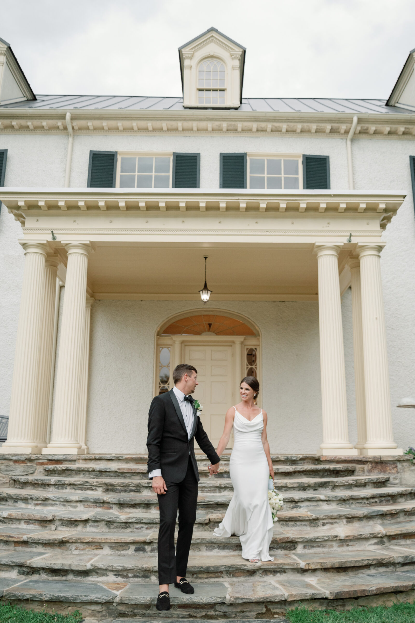 Rust Manor House Wedding in Leesburg, VA | Wedding Photographer in RVA | bride and groom walking out of the estate house at the Rust Manor wedding venue