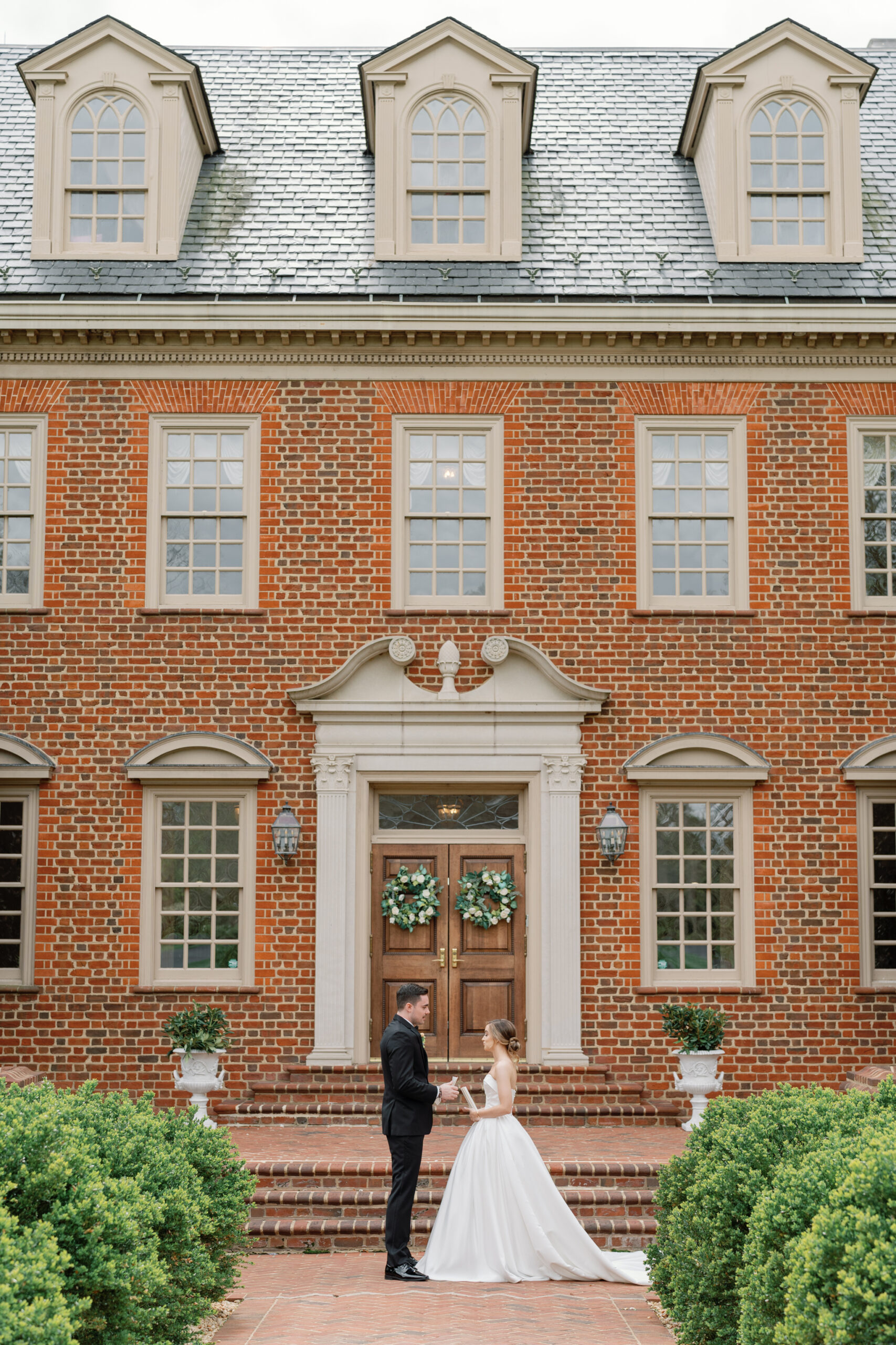 Wedding at the Estate at River Run in Maidens, VA | Wedding Photographer in Richmond | bride and groom share private vows in front of the Estate at River Run