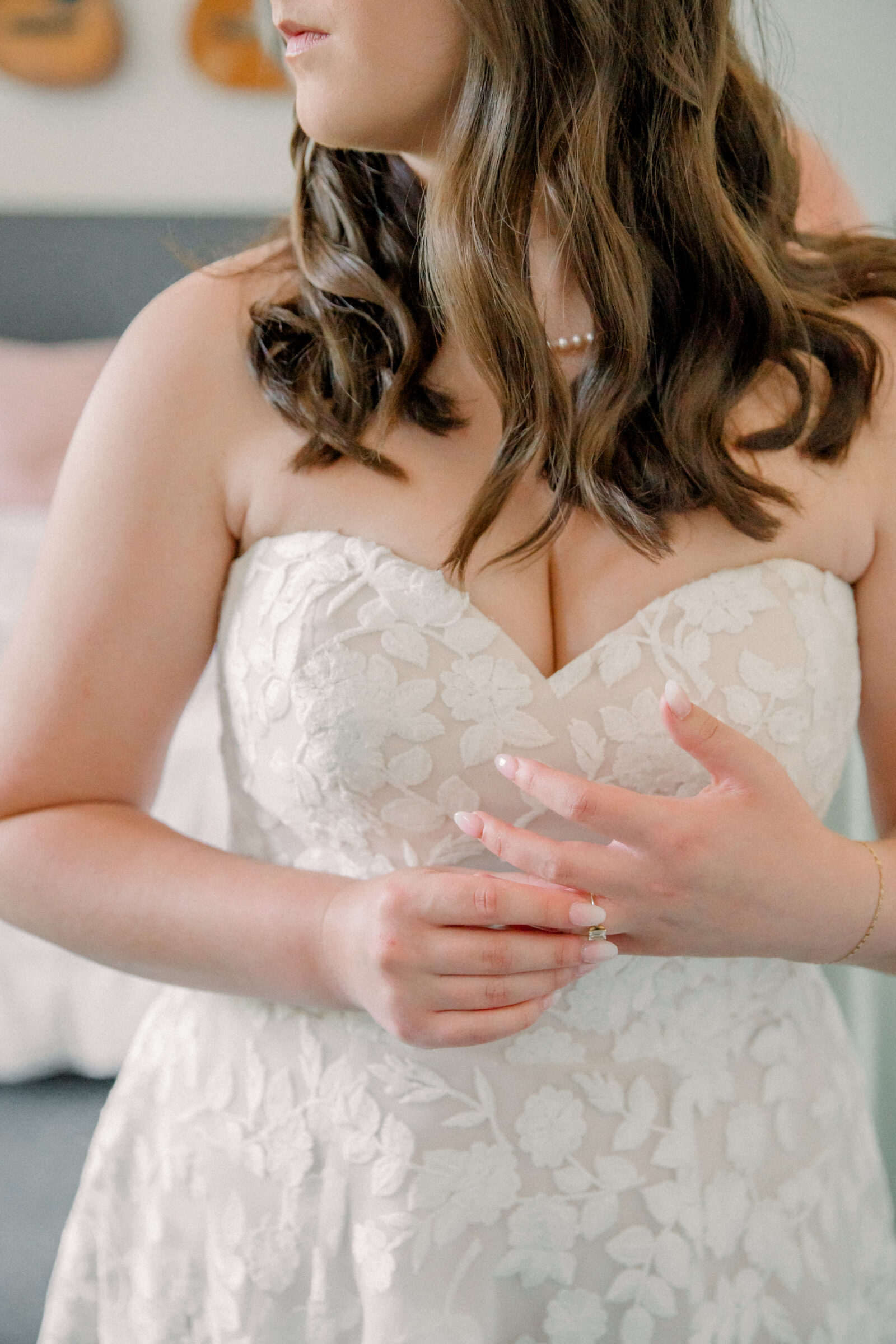 Lynchburg Virginia Wedding Photographer | bride in white floral wedding gown adjusts her engagement ring while getting ready for her wedding ceremony at Three Oaks Manor