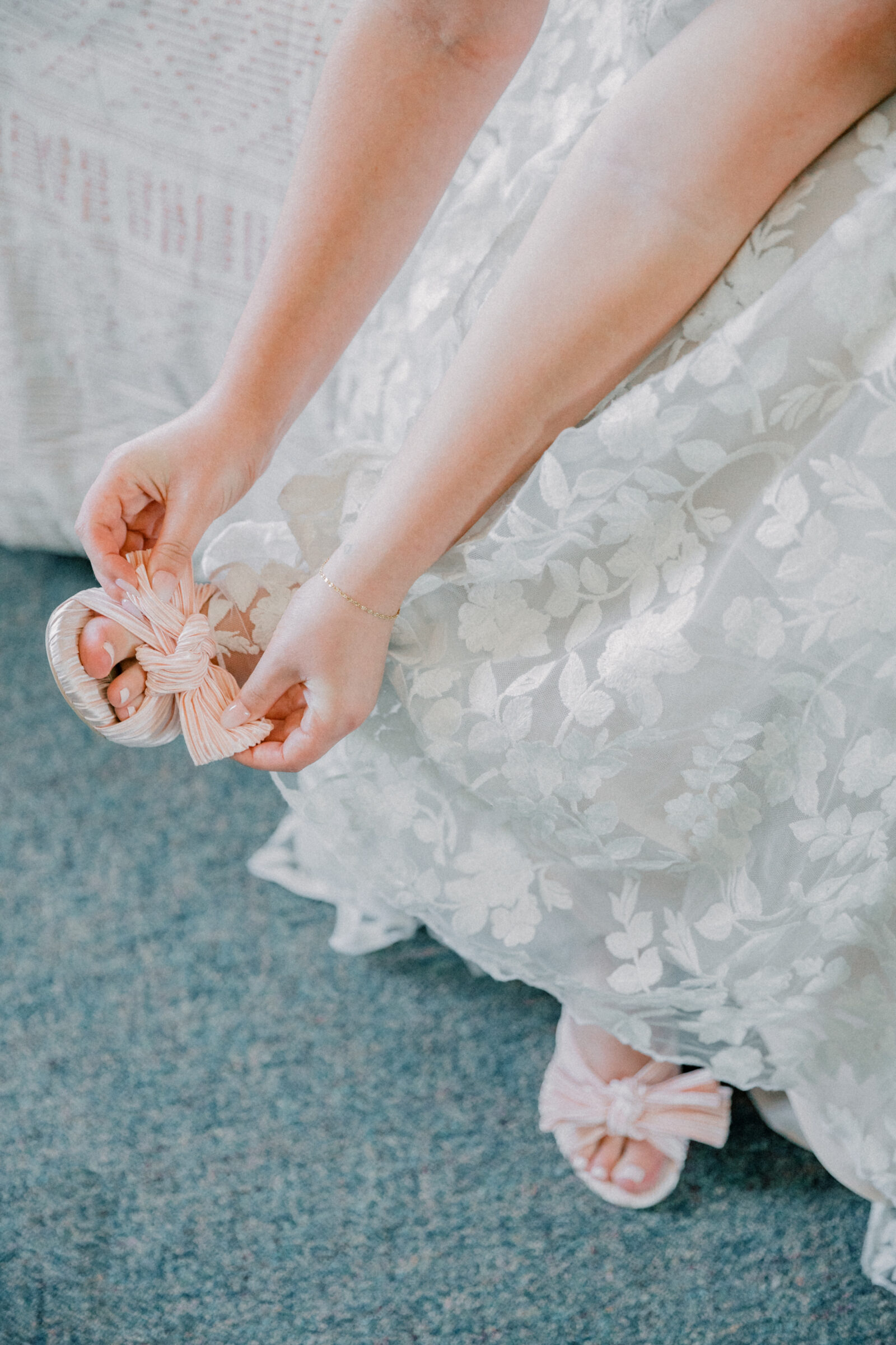 Lynchburg Virginia Wedding Photographer | closeup image of bride adjusting her pink shoes while getting ready for her Virginia wedding ceremony at Three Oaks Manor