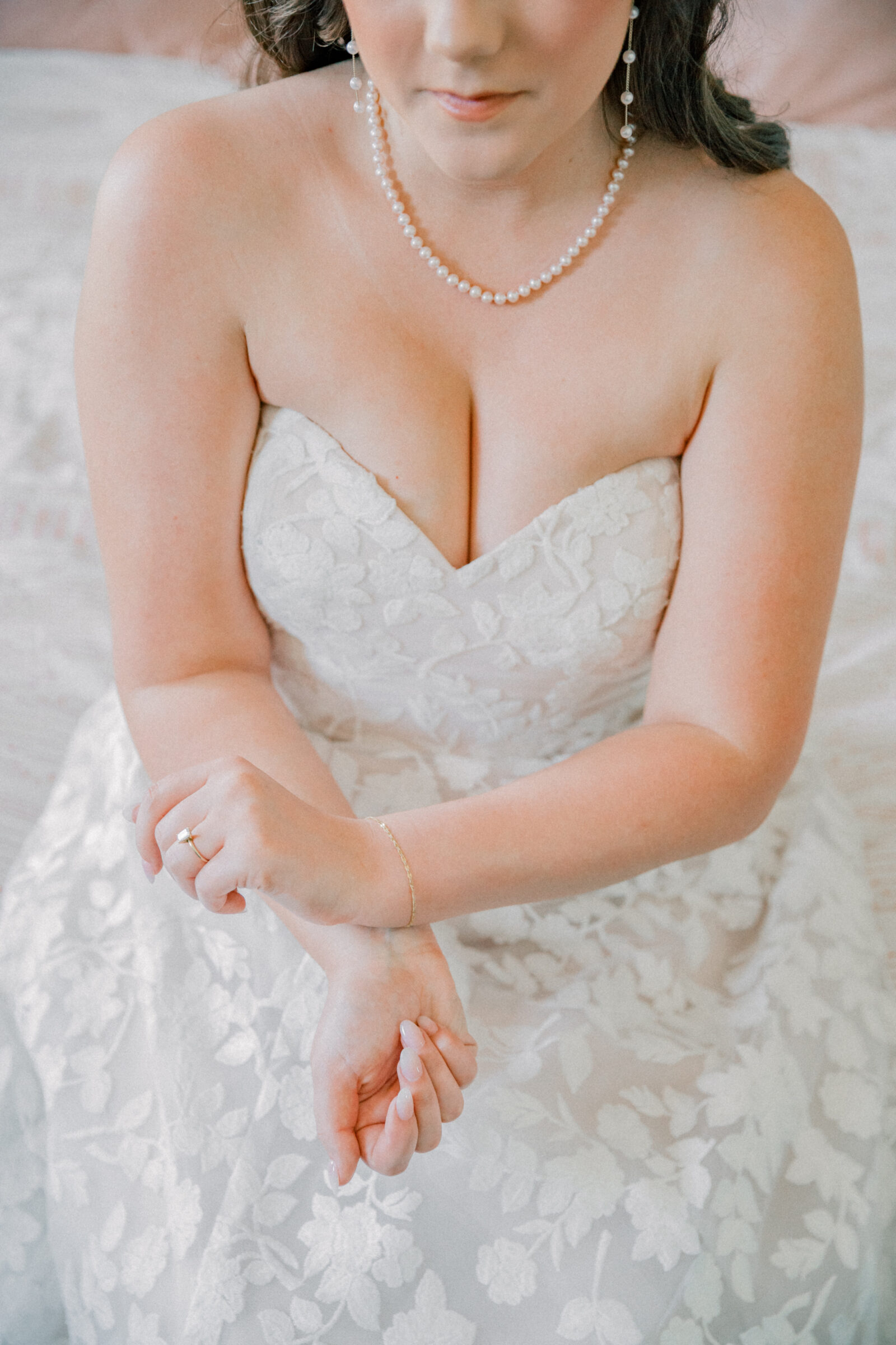 Lynchburg Virginia Wedding Photographer | bride rubs perfume onto her wrists while getting ready for her Virginia wedding at Three Oaks Manor