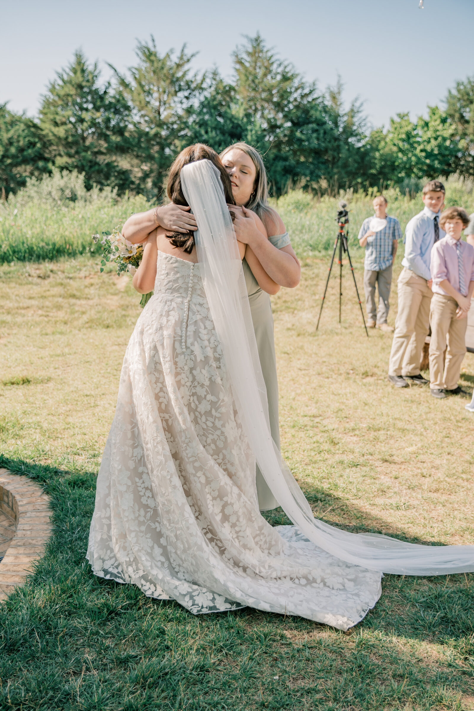 Three Oaks Manor Wedding in Madison Heights, VA | Virginia Wedding Photographer | bride and mother of the bride hug at the aisle