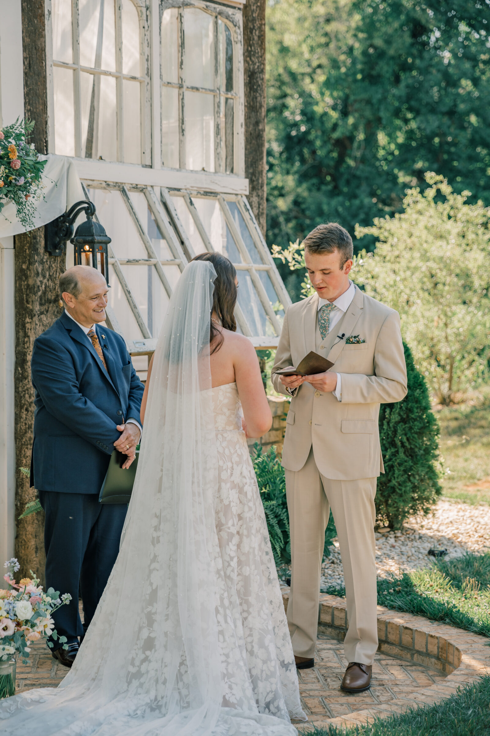 Three Oaks Manor Wedding in Madison Heights, VA | Virginia Wedding Photographer | groom reads personal vows during wedding ceremony