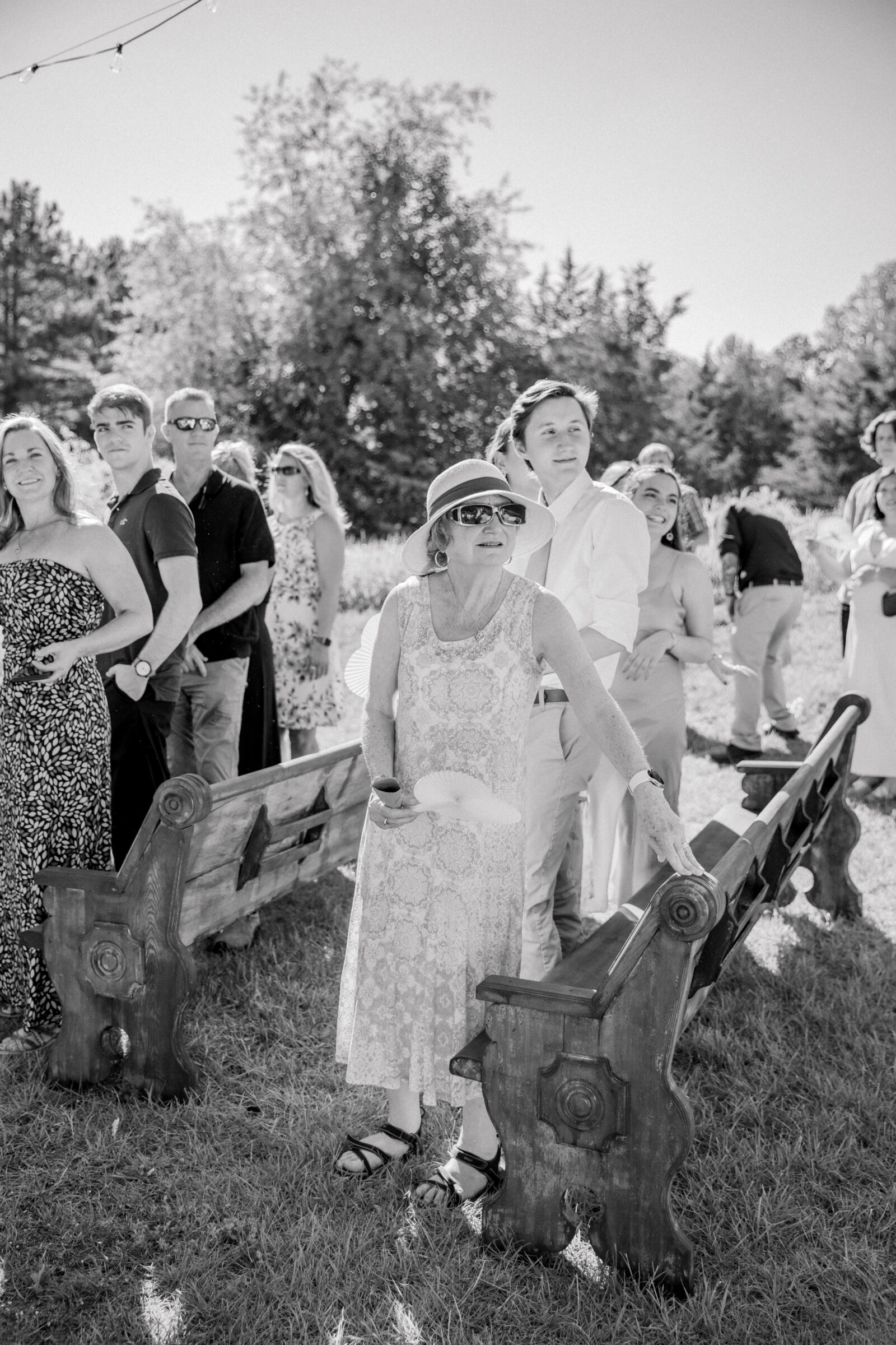 Three Oaks Manor Wedding in Madison Heights, VA | Virginia Wedding Photographer | black and white image of guests watching the bride and groom recess after their wedding ceremony