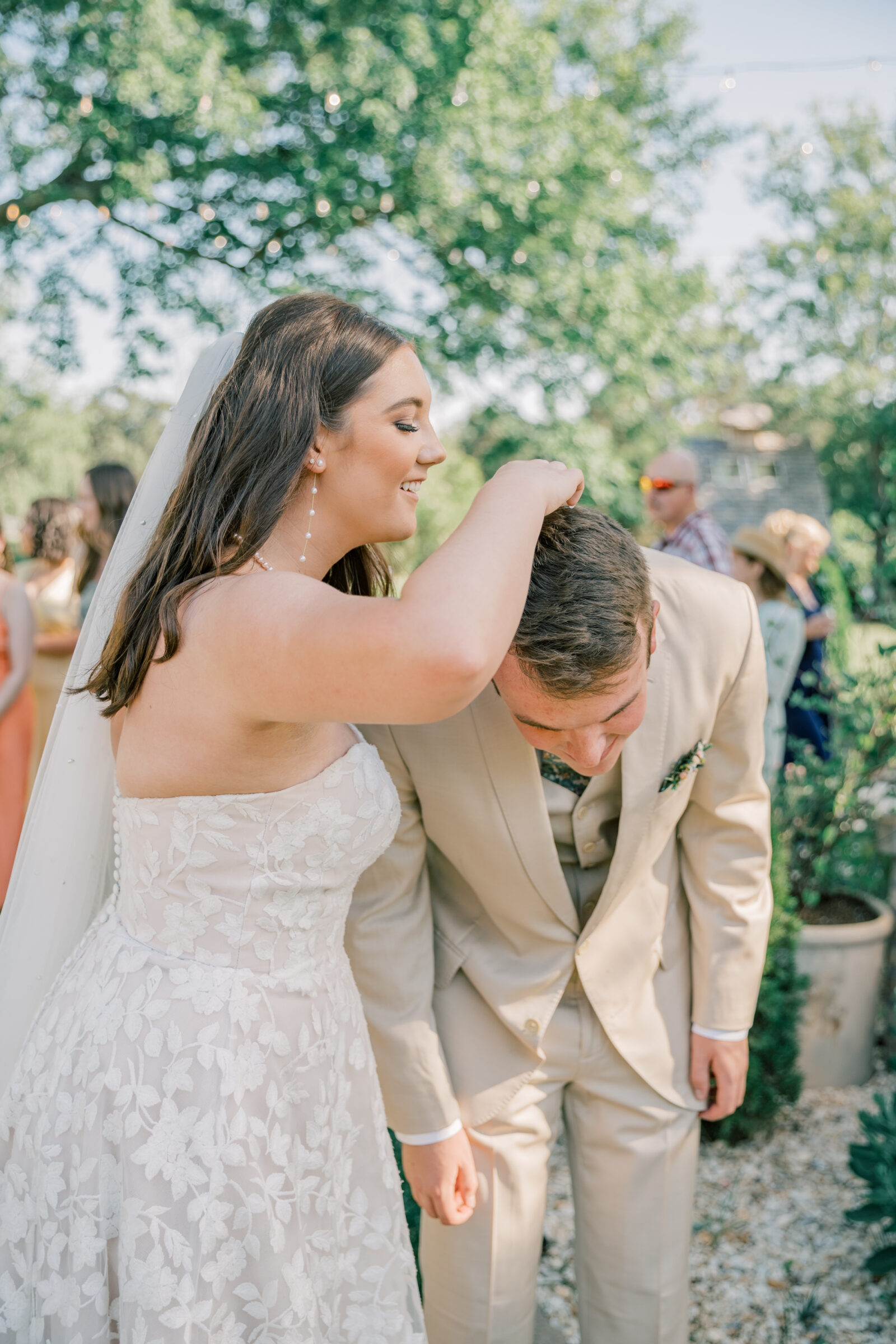 Three Oaks Manor Wedding in Madison Heights, VA | Virginia Wedding Photographer | bride removes flower petals from groom's hair after their ceremony exit