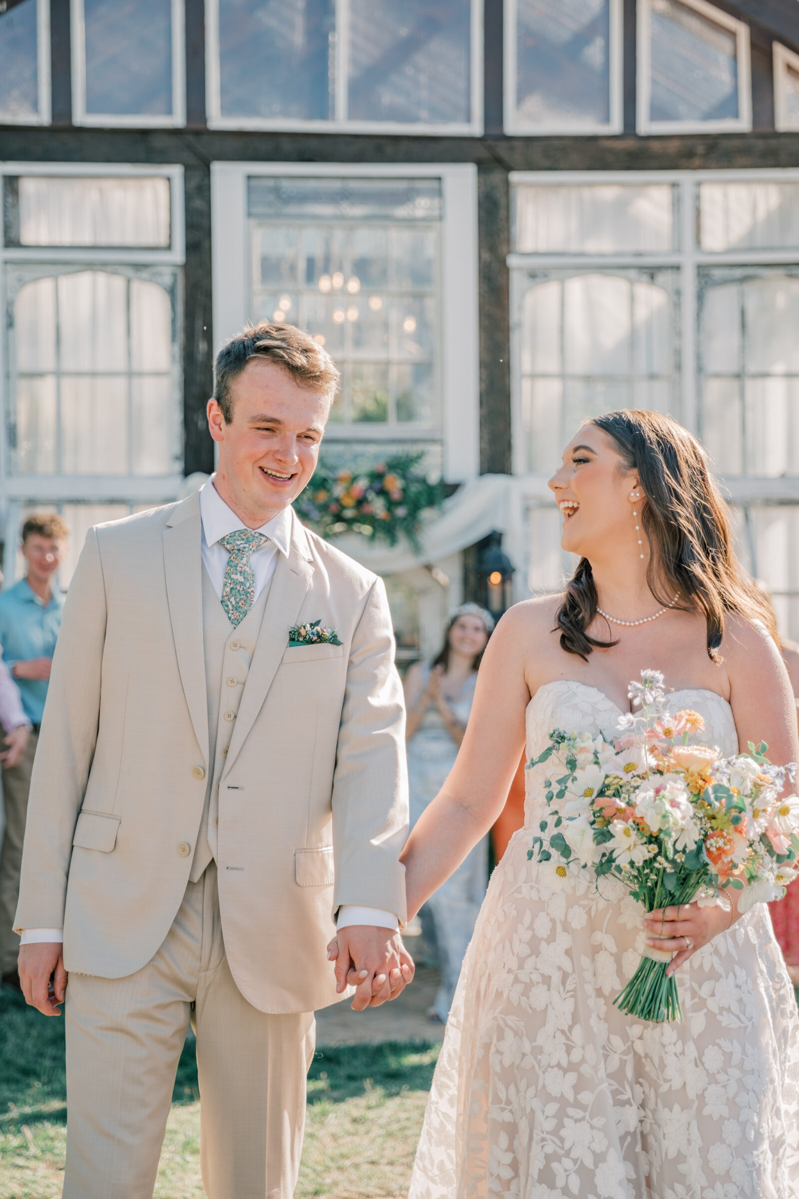 Three Oaks Manor Wedding in Madison Heights, VA | Virginia Wedding Photographer | bride and groom walk hand in hand in front of their wedding party