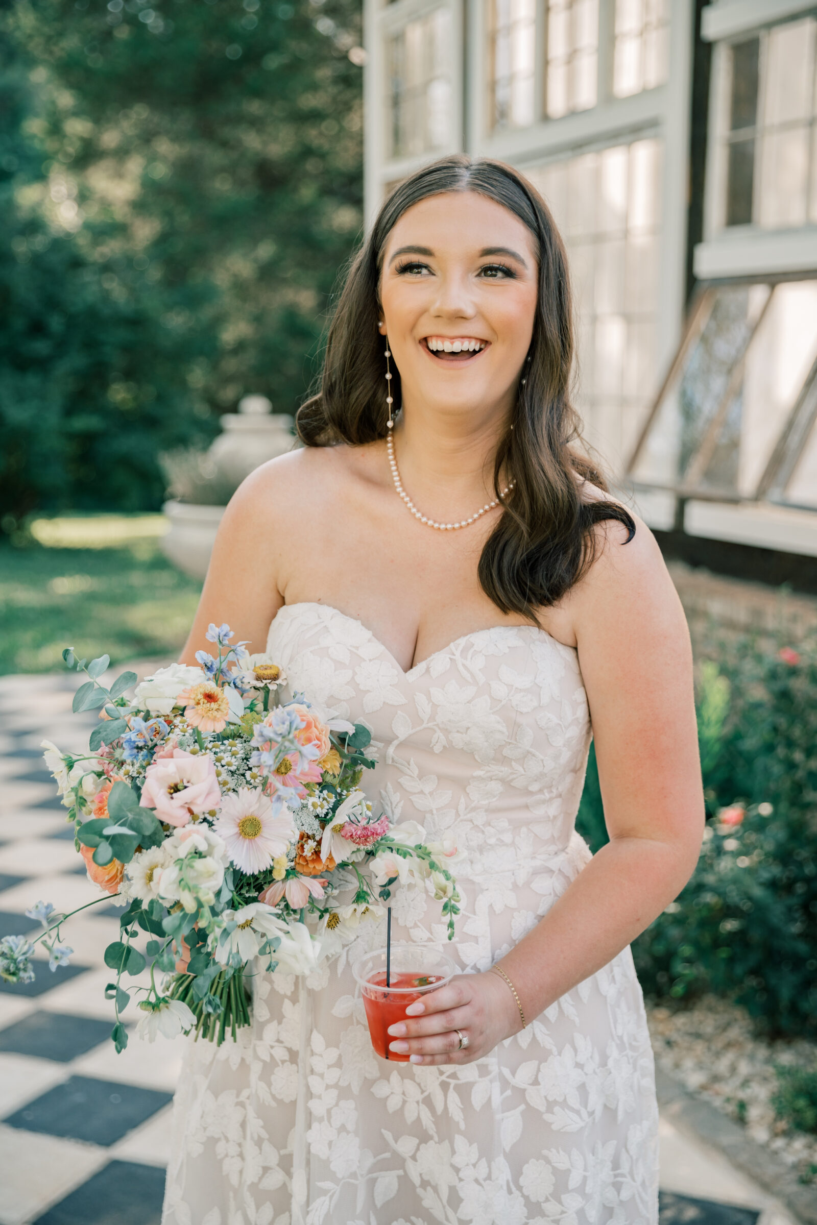 Three Oaks Manor Wedding in Madison Heights, VA | Virginia Wedding Photographer | bride laughs with signature cocktail in hand