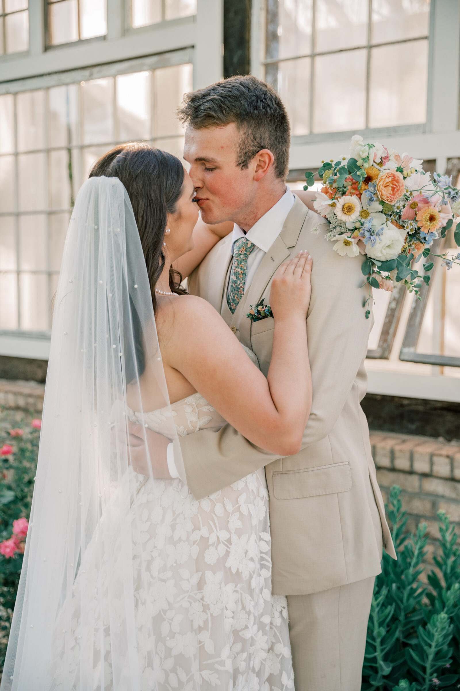 Three Oaks Manor Wedding in Madison Heights, VA | Virginia Wedding Photographer | groom in tan suit tenderly kisses the tip of his bride's nose