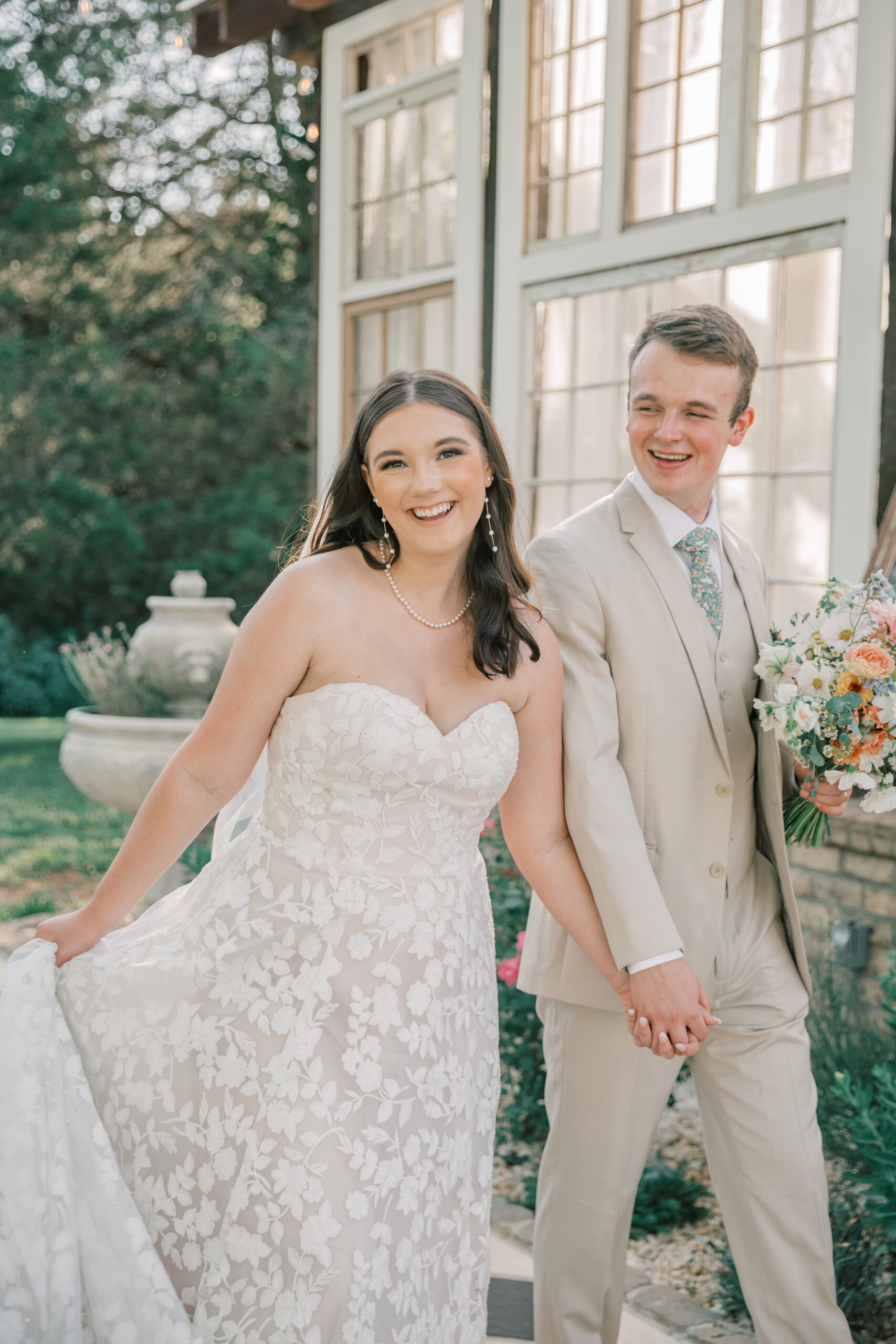 Three Oaks Manor Wedding in Madison Heights, VA | Lynchburg Virginia Wedding Photographer | bride and groom holding hands and walking outside of a greenhouse