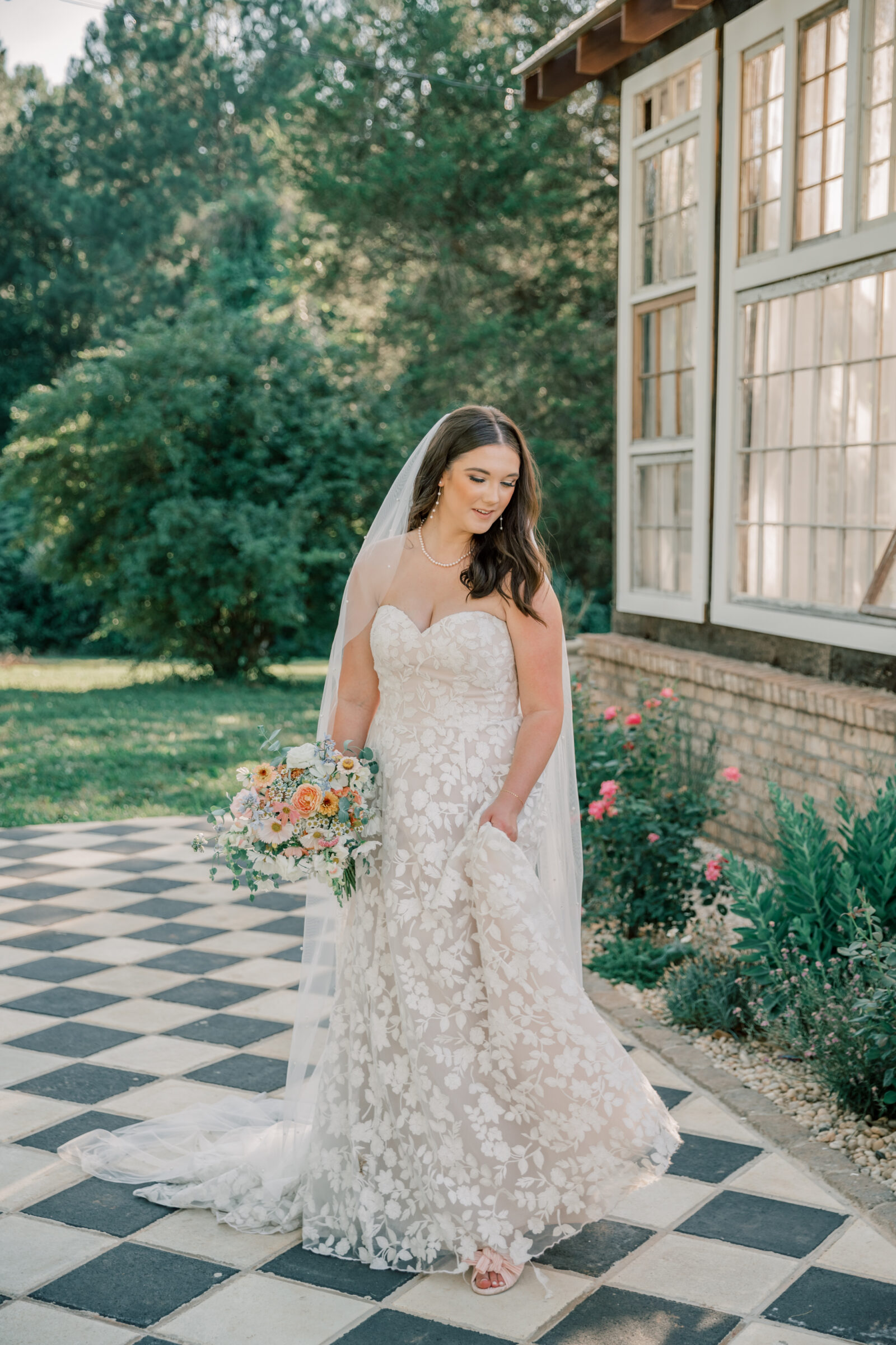 Three Oaks Manor Wedding in Madison Heights, VA | Virginia Wedding Photographer | bride romantically twirls in her dress outside of the greenhouse at Three Oaks Manor