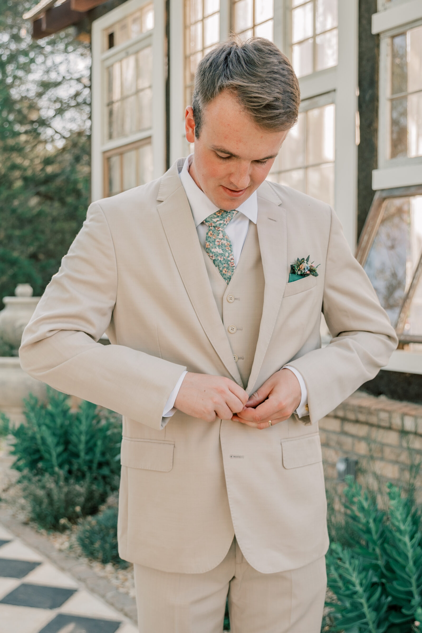 Three Oaks Manor Wedding in Madison Heights, VA | groom in tan suit buttons jacket