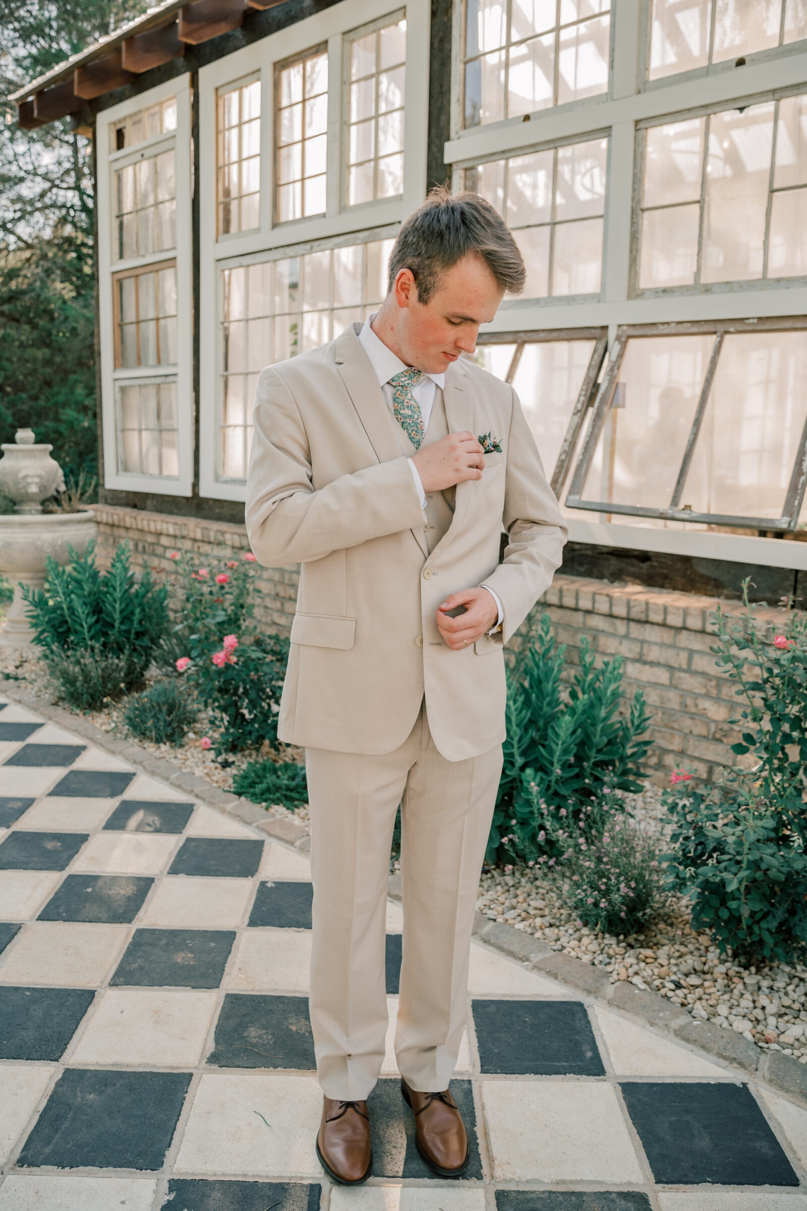 Three Oaks Manor Wedding in Madison Heights, VA | groom in tan suit adjusts his jacket