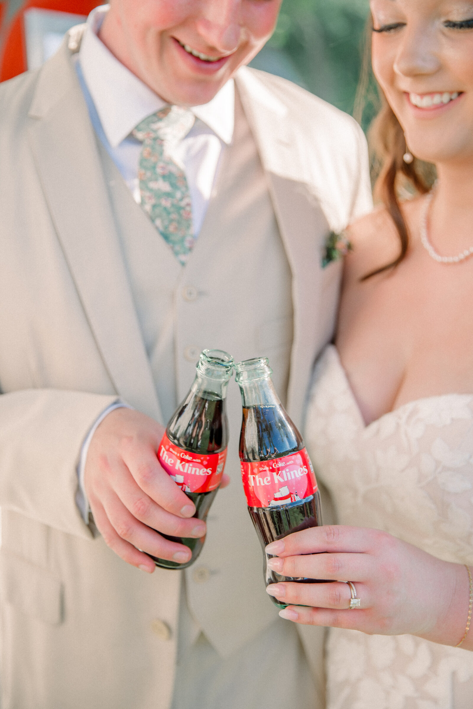 Three Oaks Manor Wedding in Madison Heights, VA | Virginia Wedding Photographer | bride and groom clink their custom Coca-Cola bottles together that say "Share a Coke with The Klines"