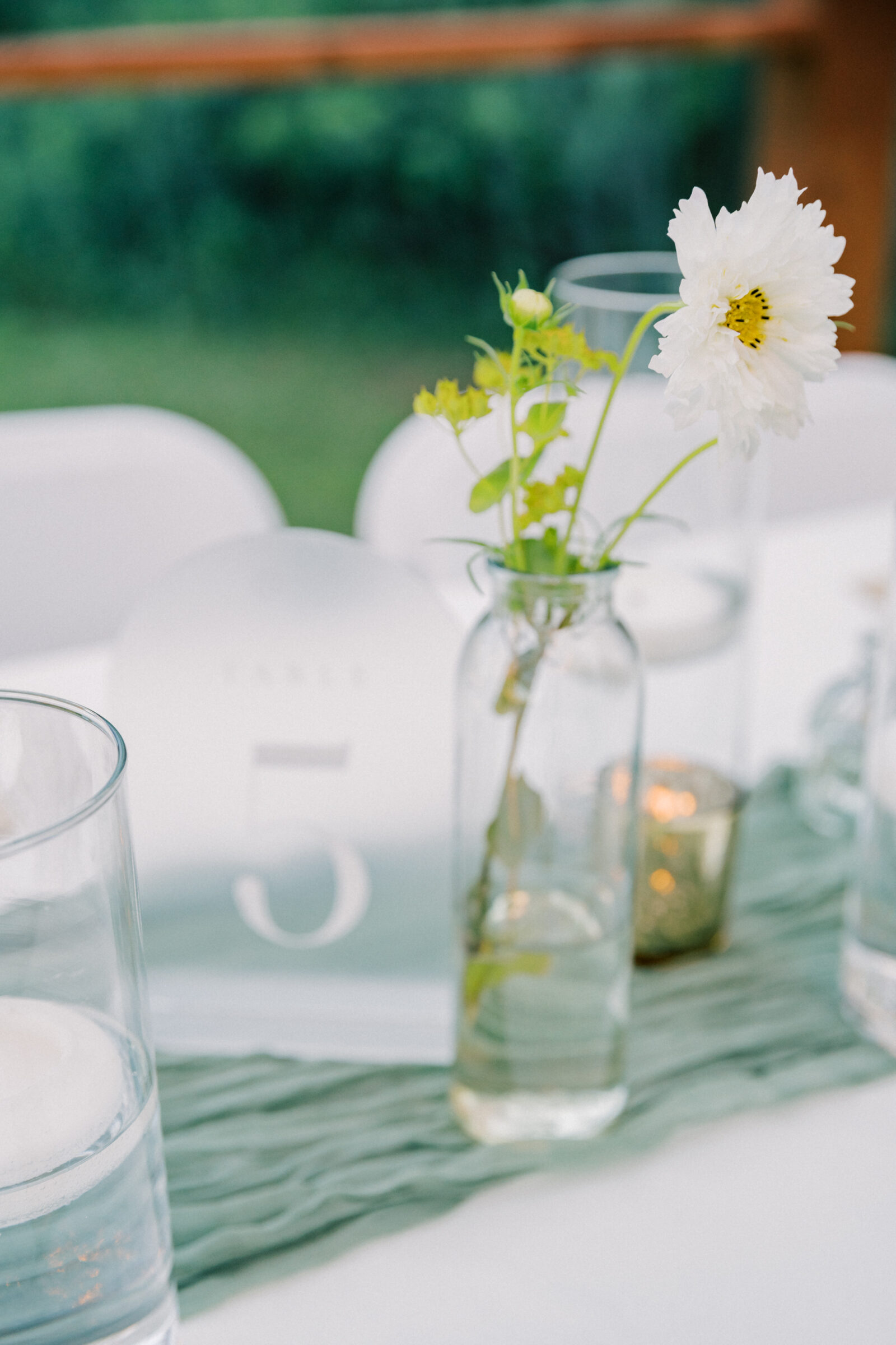 Three Oaks Manor Wedding in Madison Heights, VA | Virginia Wedding Photographer | wildflower in a bud vase with a table number and candles in the background