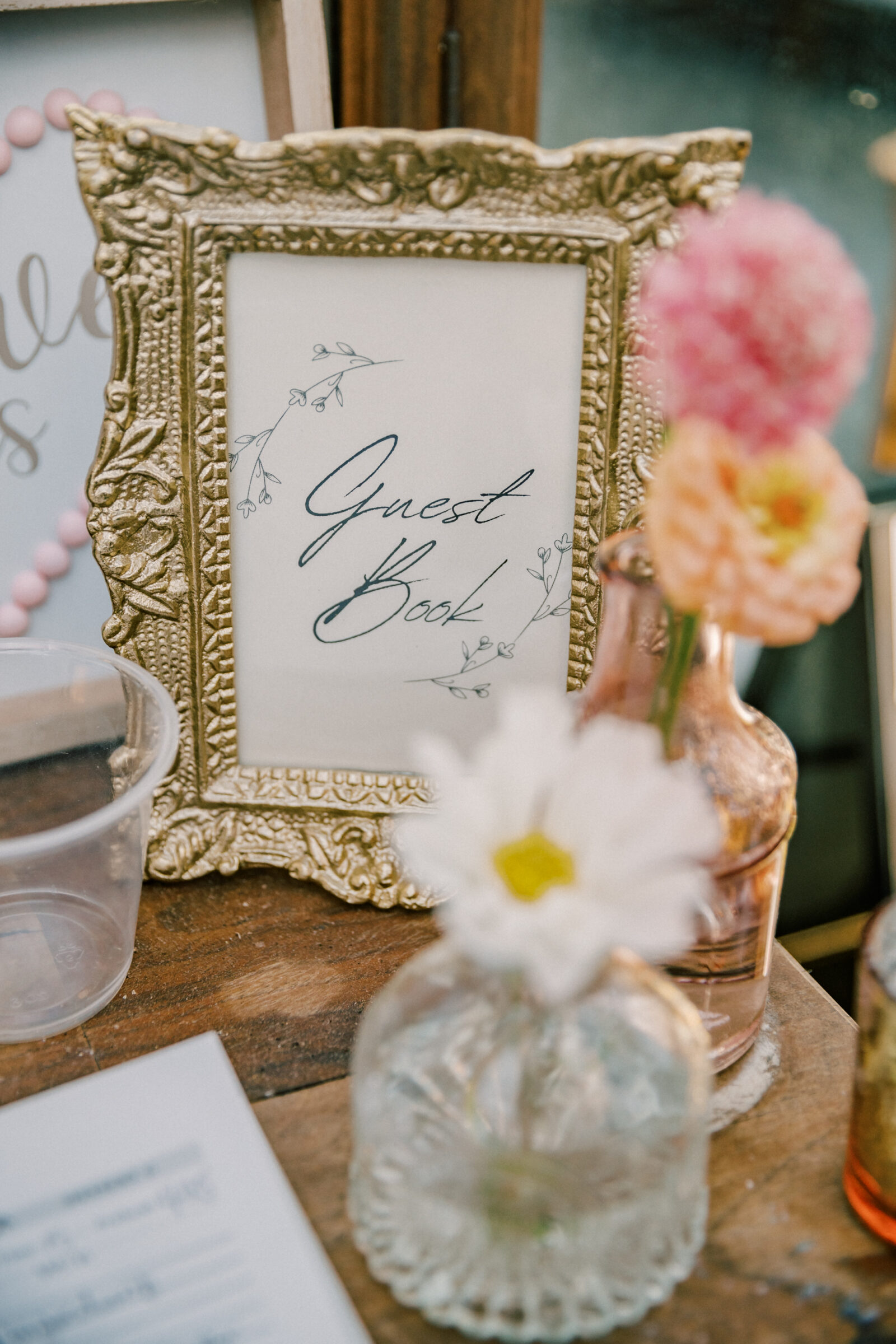 Three Oaks Manor Wedding in Madison Heights, VA | Virginia Wedding Photographer | guest book sign in a gold frame surrounded by florals in bud vases