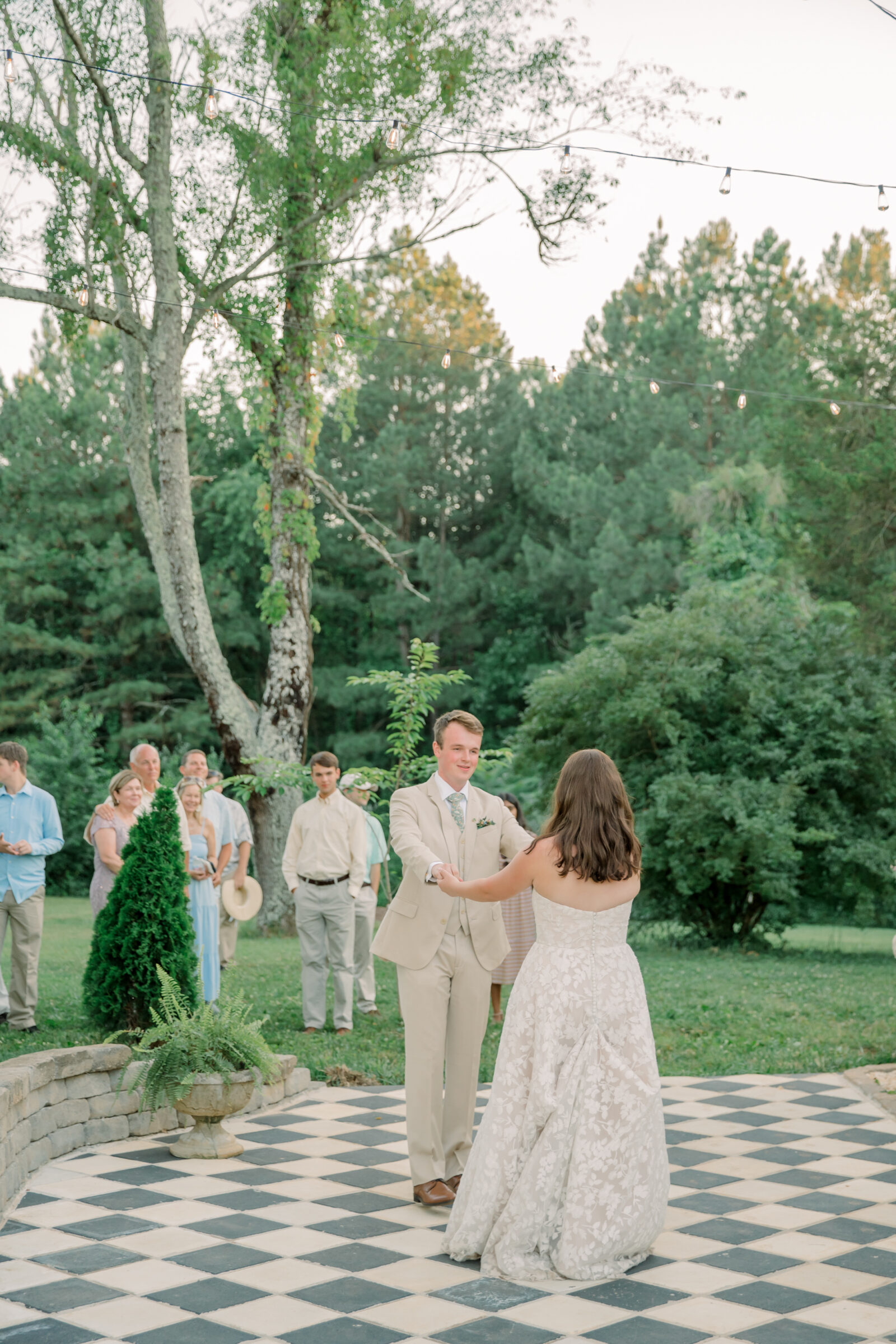 Three Oaks Manor Wedding in Madison Heights, VA | Virginia Wedding Photographer | bride and groom share a first dance on the black and white checkered dance floor at Three Oaks Manor