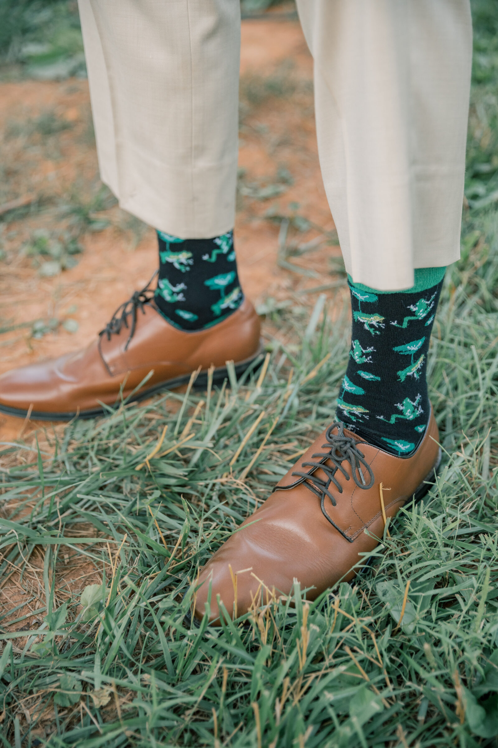 Three Oaks Manor Wedding in Madison Heights, VA | closeup image of groom wearing frog socks