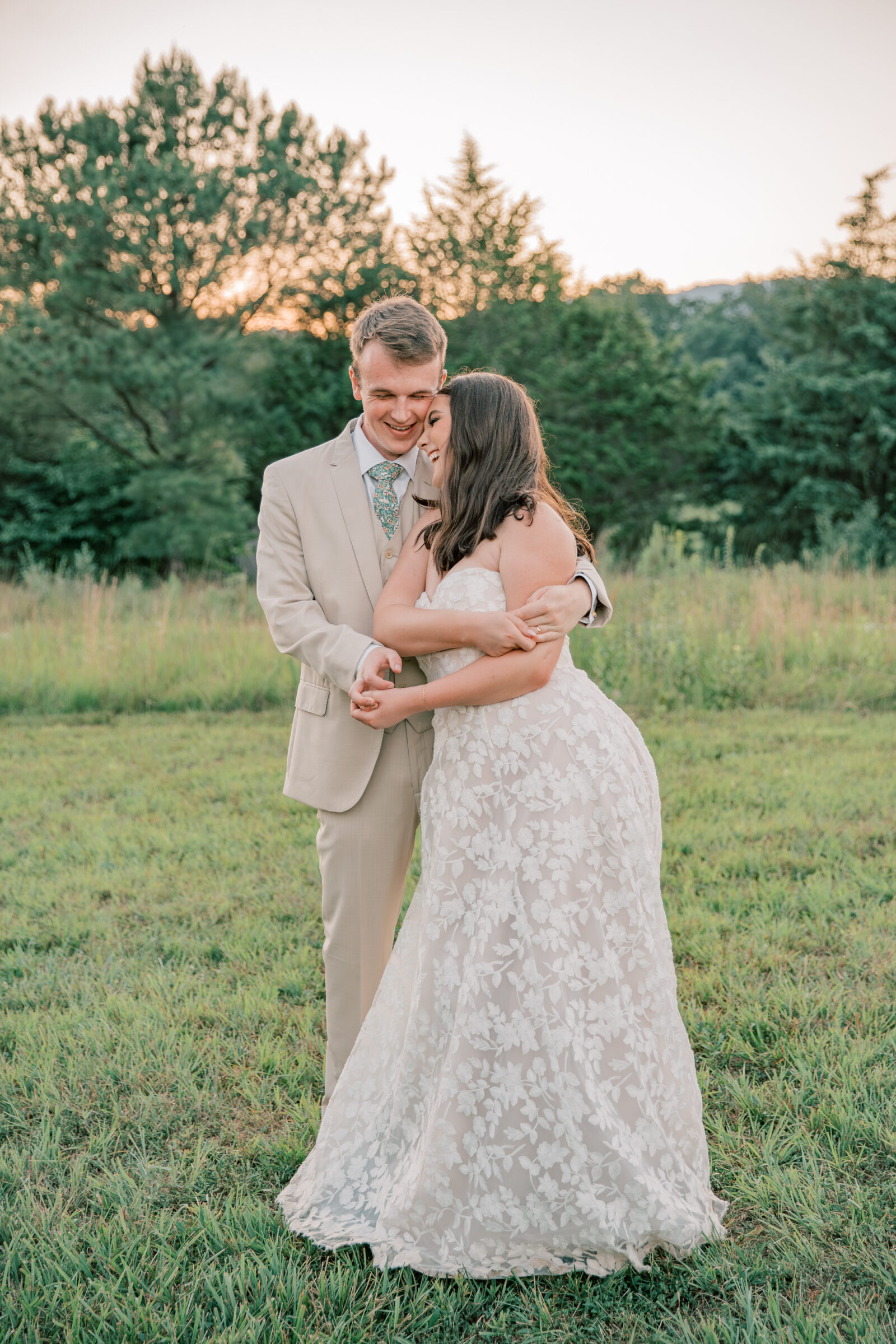 Three Oaks Manor Wedding in Madison Heights, VA | Virginia Wedding Photographer | groom twirls his bride into his arm laughing