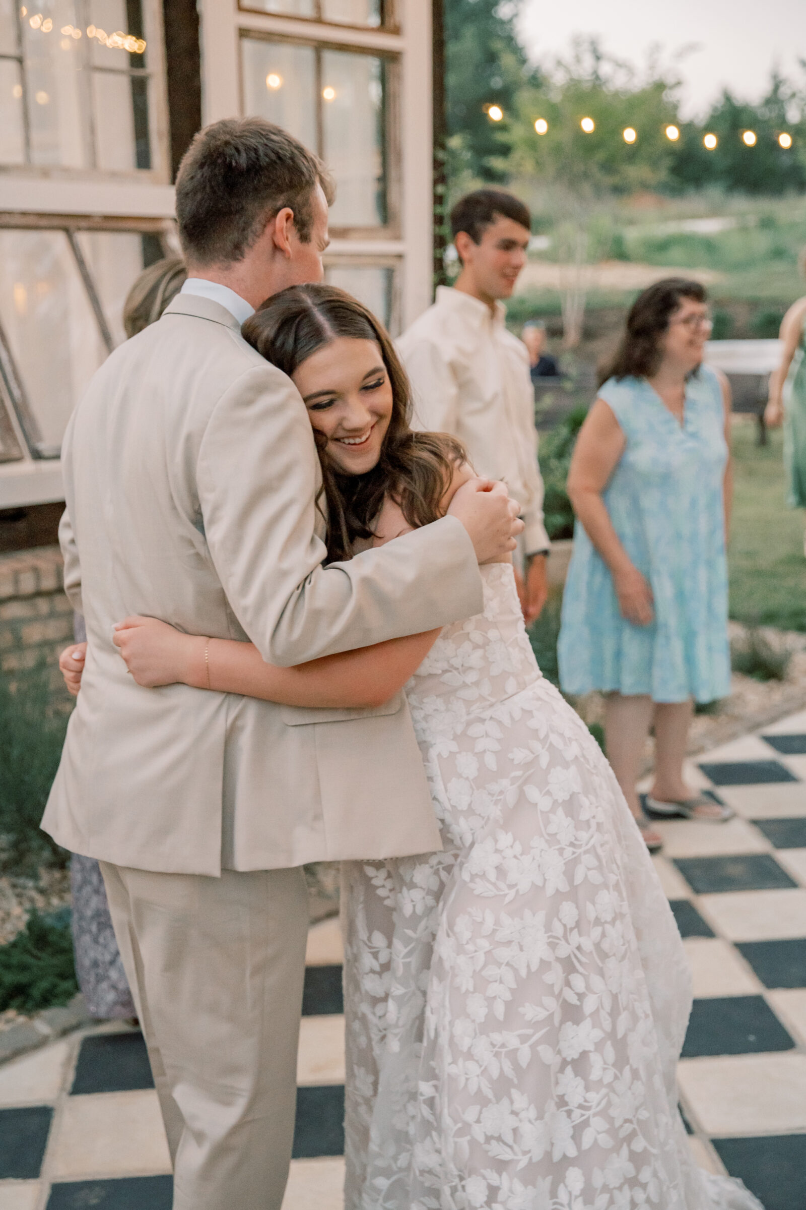 Three Oaks Manor Wedding in Madison Heights, VA | Virginia Wedding Photographer | bride and groom share a hug on the dance floor of their wedding reception