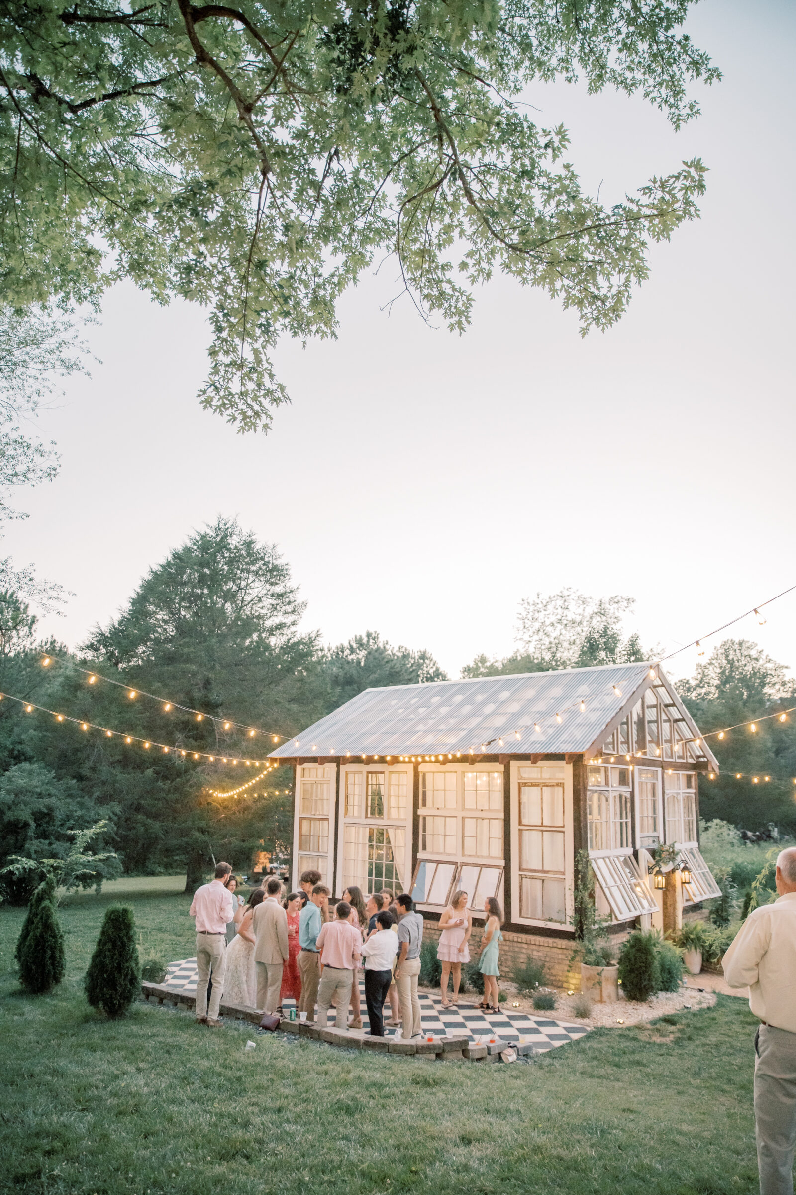 Three Oaks Manor Wedding in Madison Heights, VA | Virginia Wedding Photographer | guests on the dance floor outside of the greenhouse at Three Oaks Manor