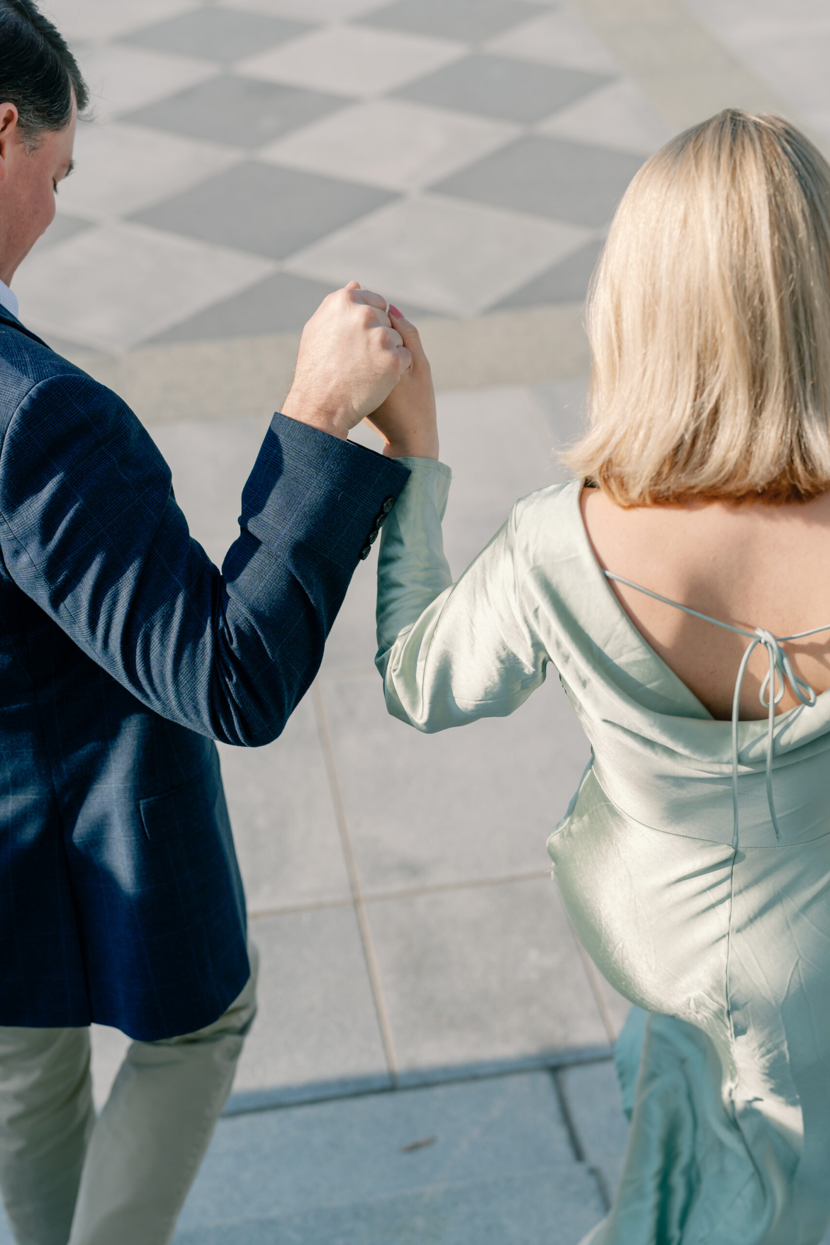 Engagement Session at the Virginia Capitol Building | Engagement Photographer in Richmond VA | engaged couple holding hands as they walk down the stairs of the Virginia Capitol Building, a historic engagement session in Richmond