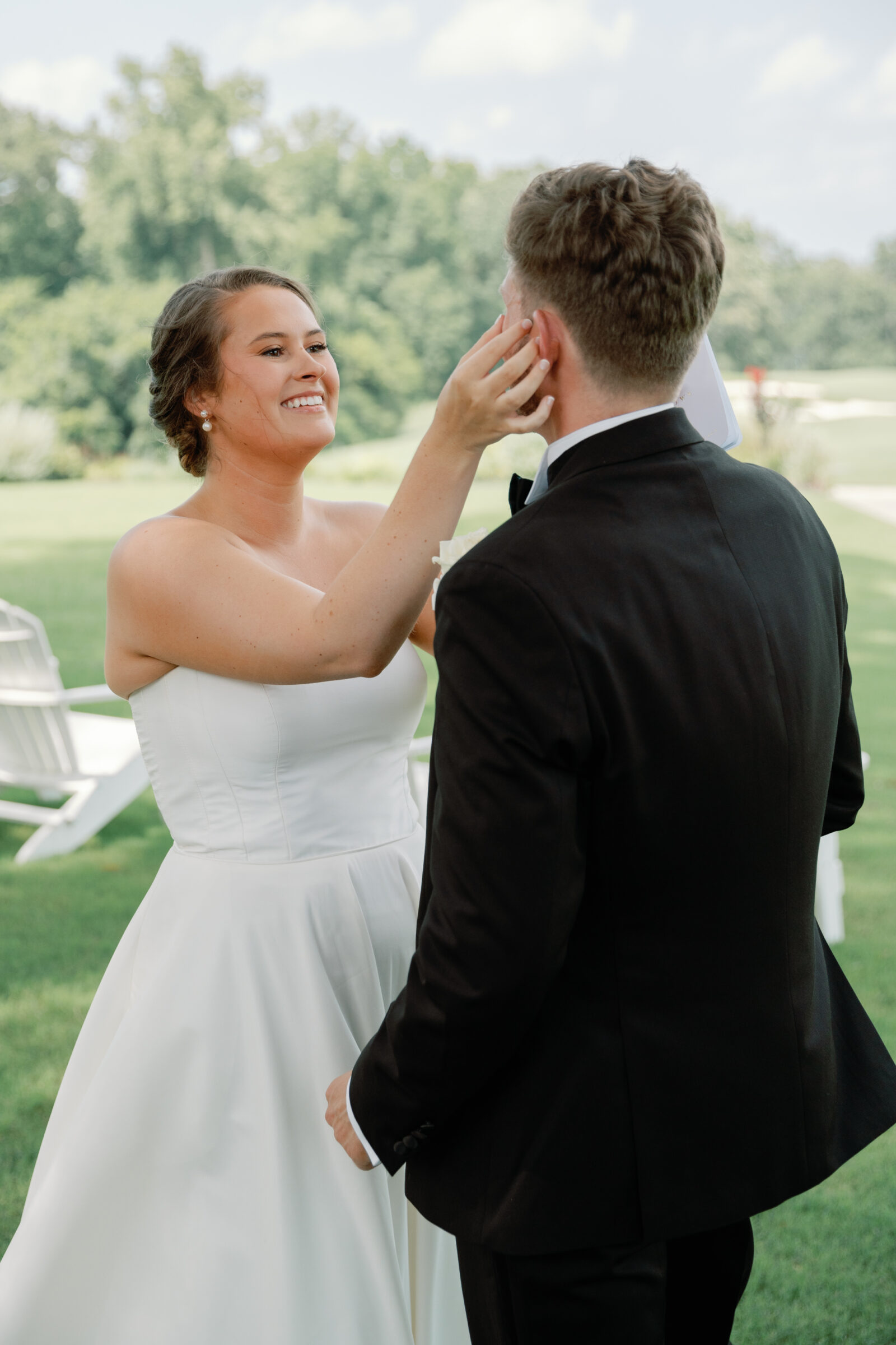 Willow Oaks Country Club Wedding in Richmond, VA | Country Club Venues in Richmond | bride wiping tear from groom's face during an emotion first look at Richmond wedding