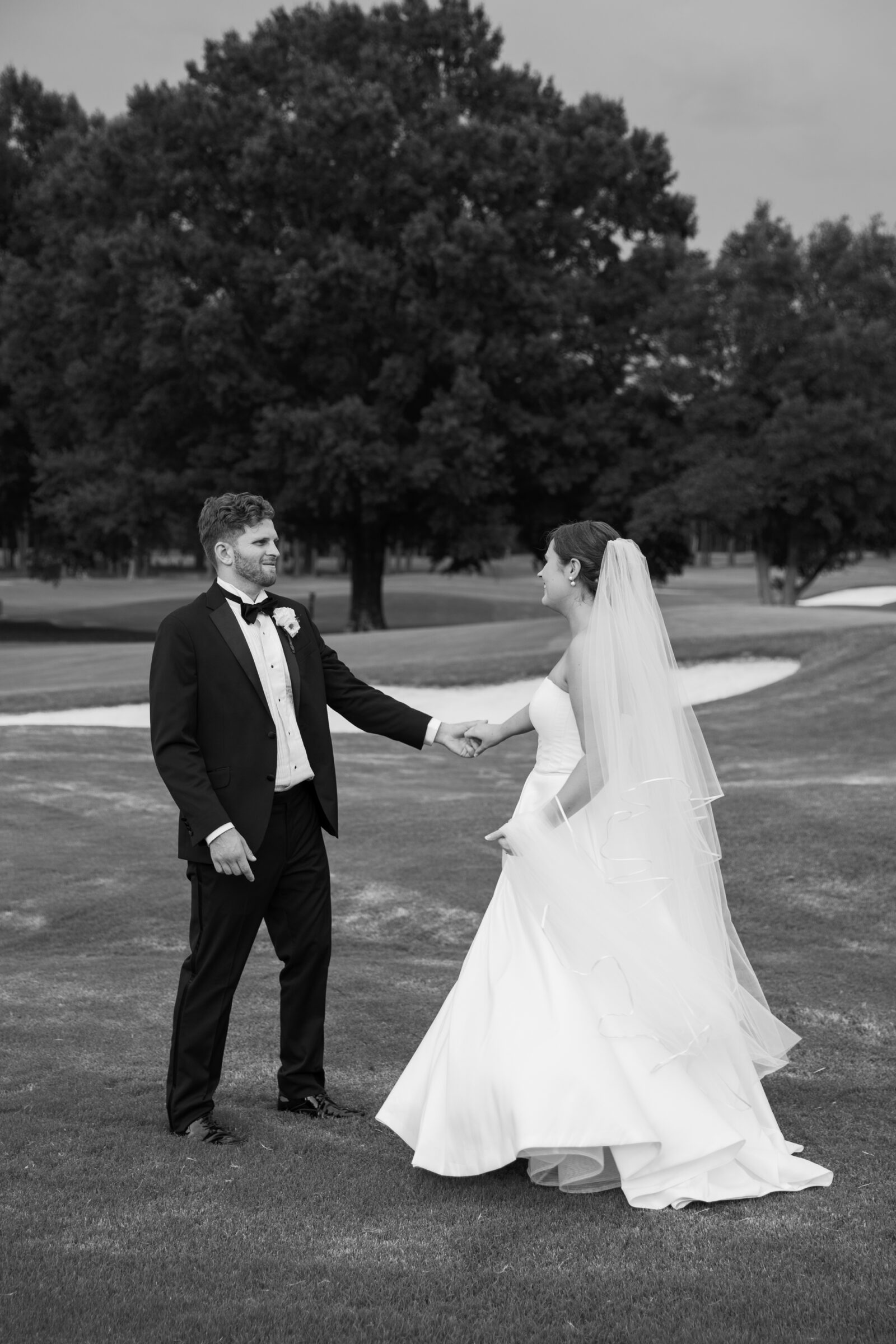 Willow Oaks Country Club Wedding in Richmond, VA | Country Club Venues in Richmond | black and white image of bride and groom dancing during sunset on the golf course of a Richmond country club venue, Willow Oaks Country Club