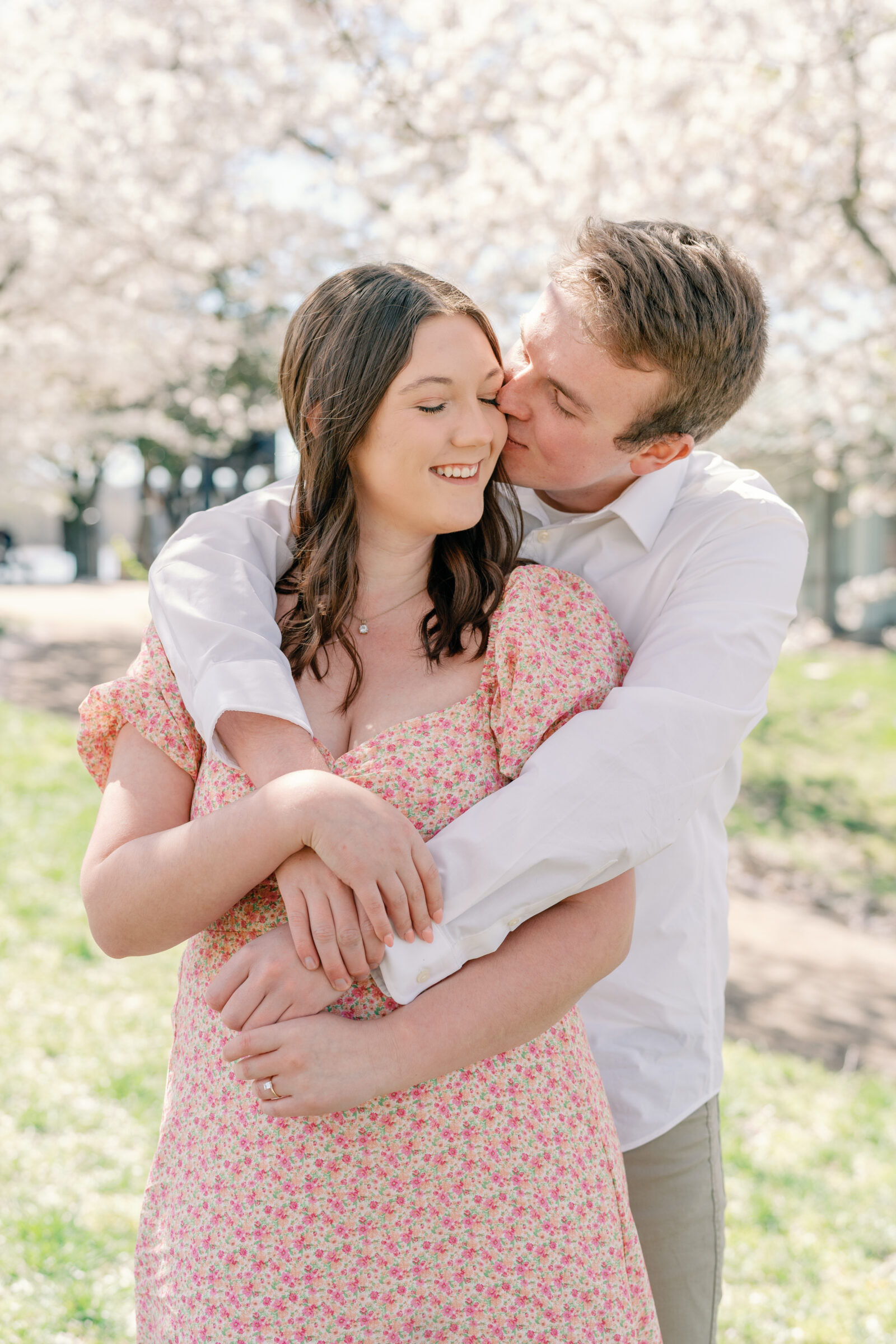 Engagement Session at Belle Ilse in Richmond VA | groom gives his future wife a kiss under the cherry blossoms