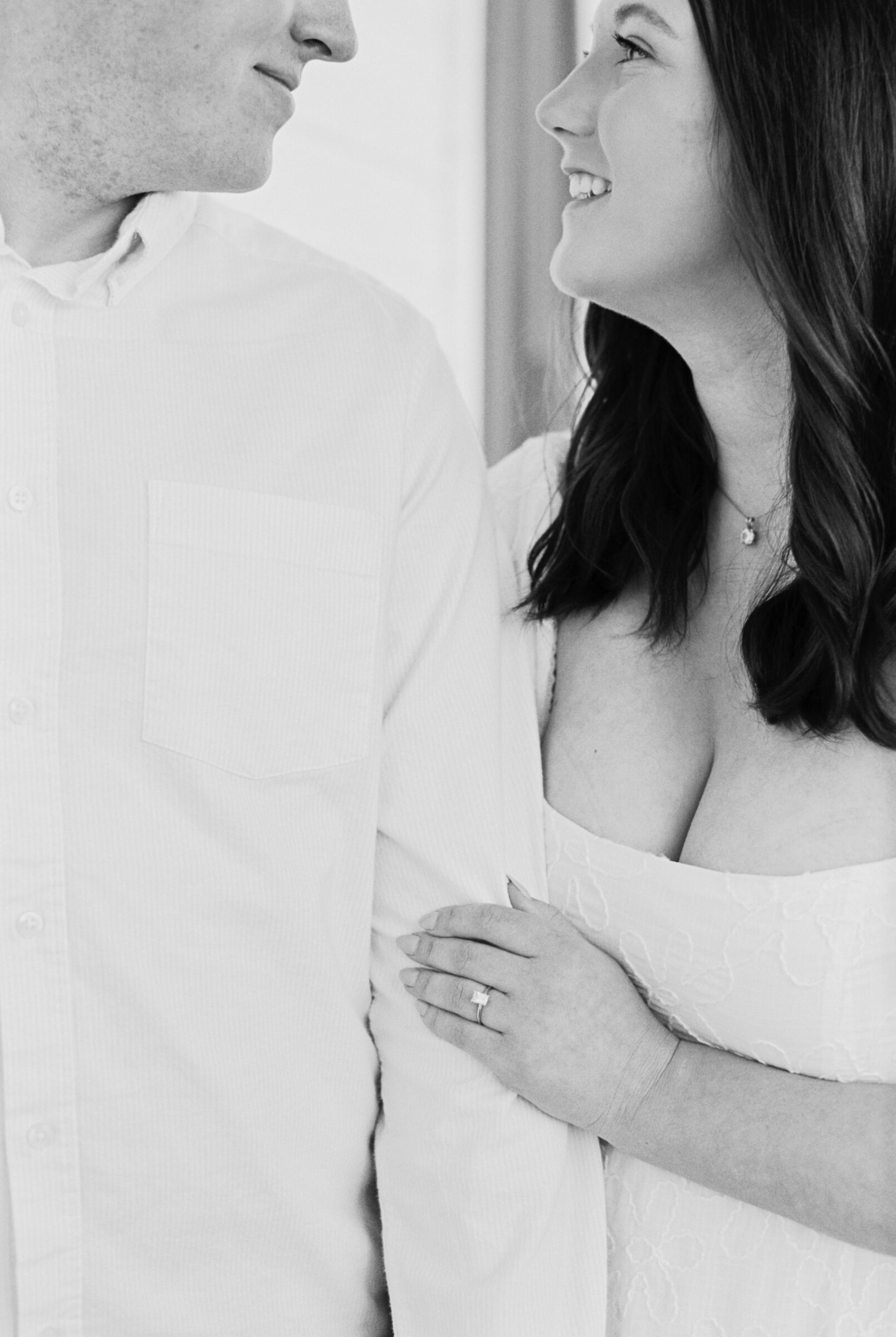 Engagement Session at the VMFA in Richmond VA | black and white image of an engagement ring as the finacee rests her hand on her future husband's arm