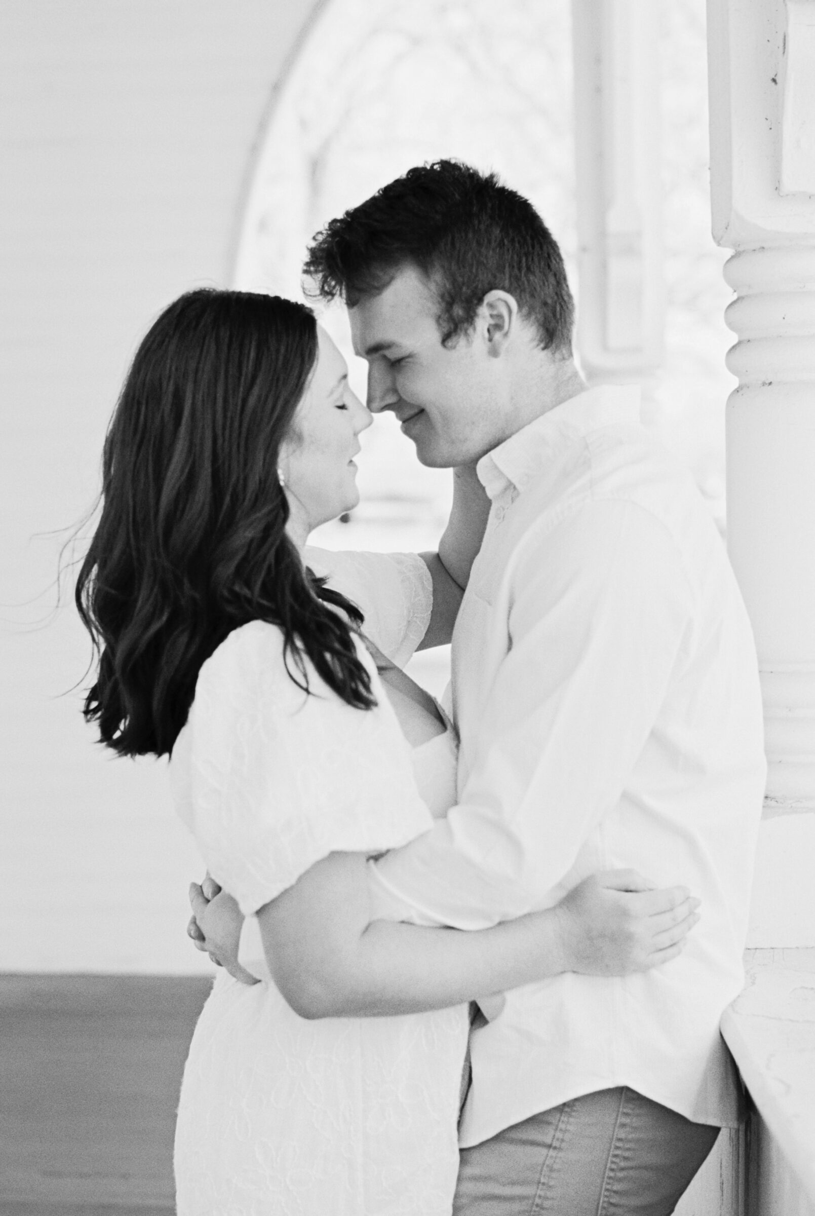 Engagement Session at the VMFA in Richmond VA | romantic black and white image, taken on film, a couple rests their noses together