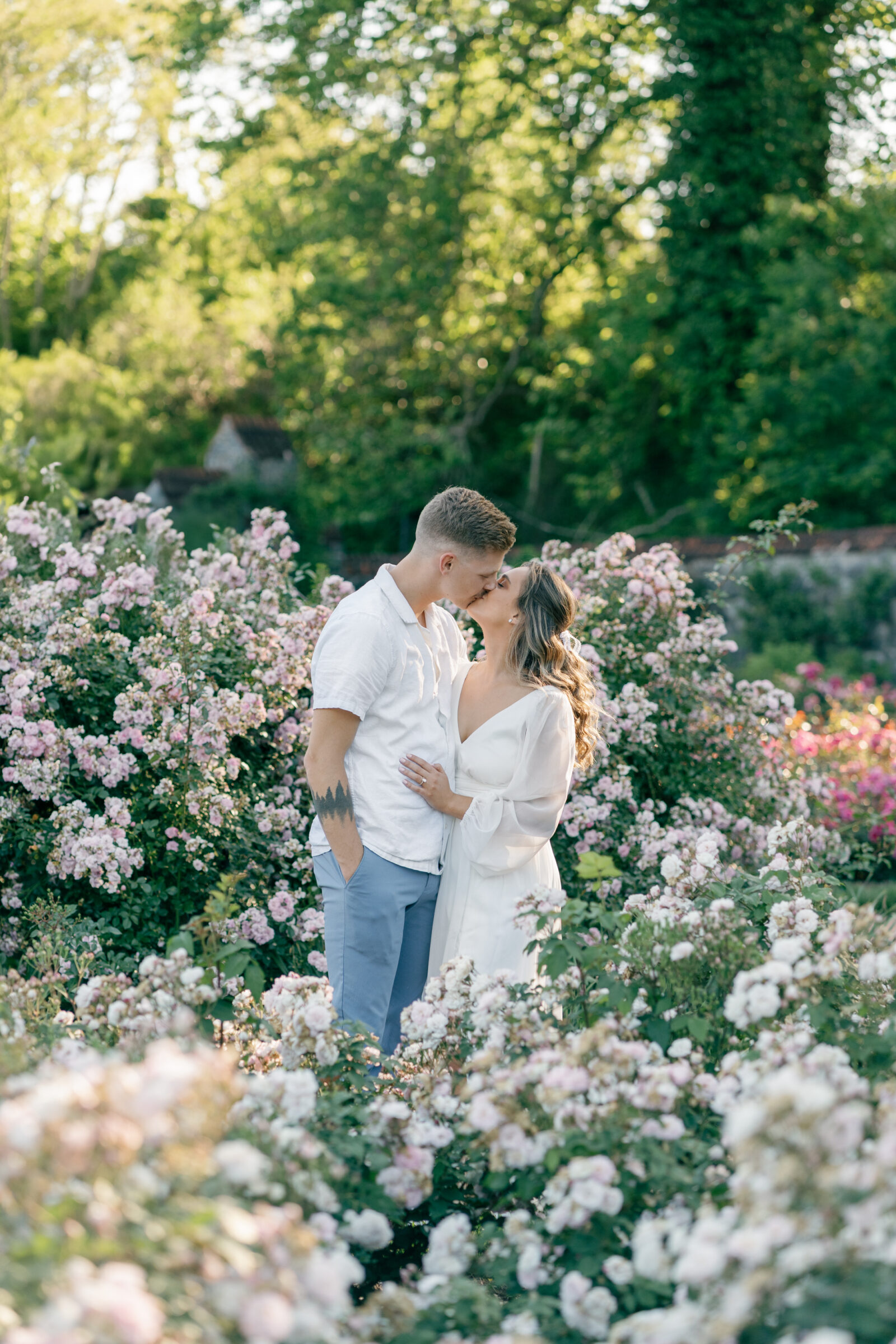 Engagement Photos at the Biltmore Estate Gardens | couple share a kiss in the garden