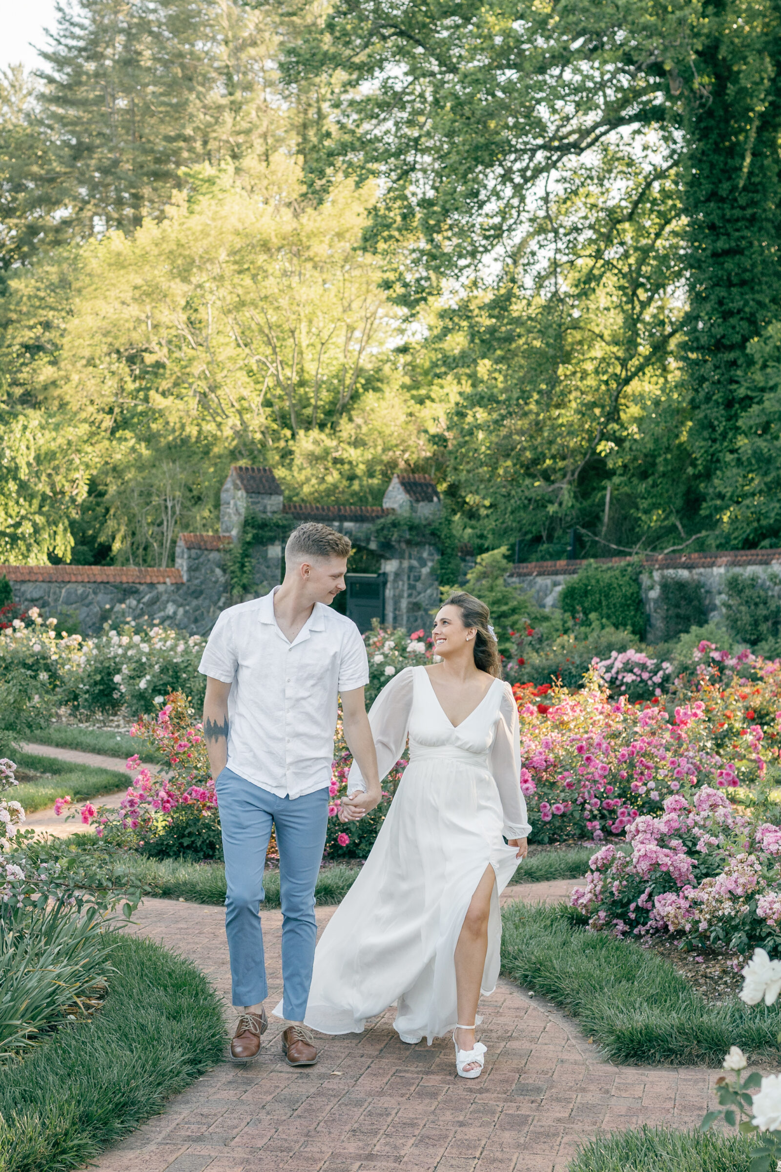 Engagement Photos at the Biltmore Estate Gardens | couple walking through the garden