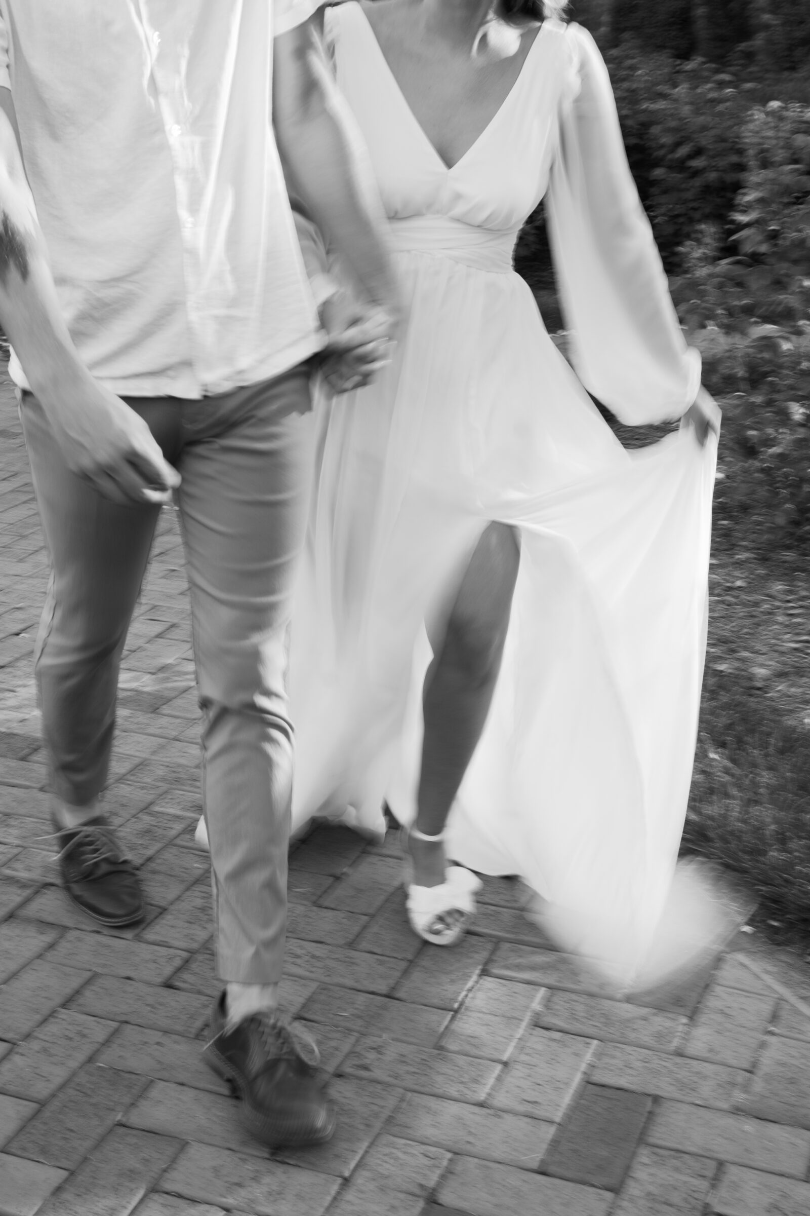 Engagement Photos at the Biltmore Estate Gardens | blurry black and white image of couple walking together