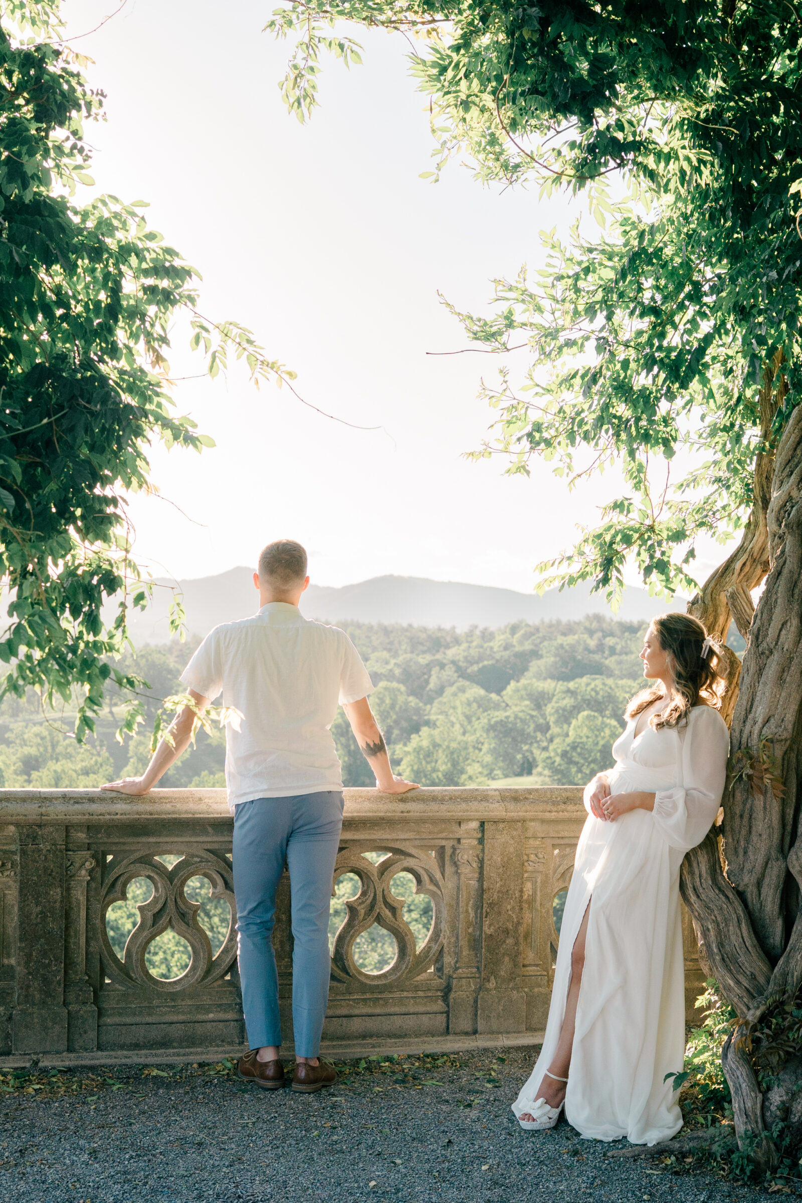 Engagement Photos at the Biltmore Estate | couple look at mountains on the terrace