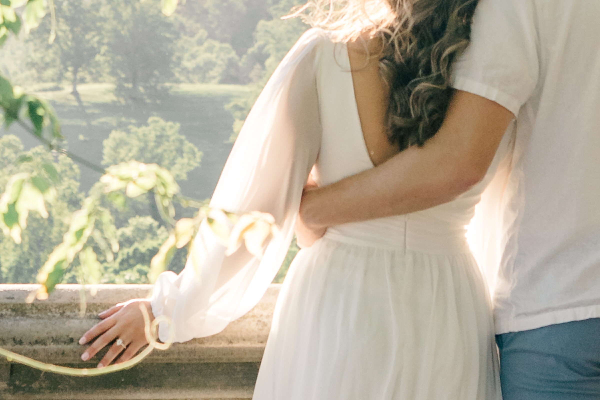 Engagement Photos at the Biltmore Estate | closeup of guy's arm around girl, showing her engagement ring