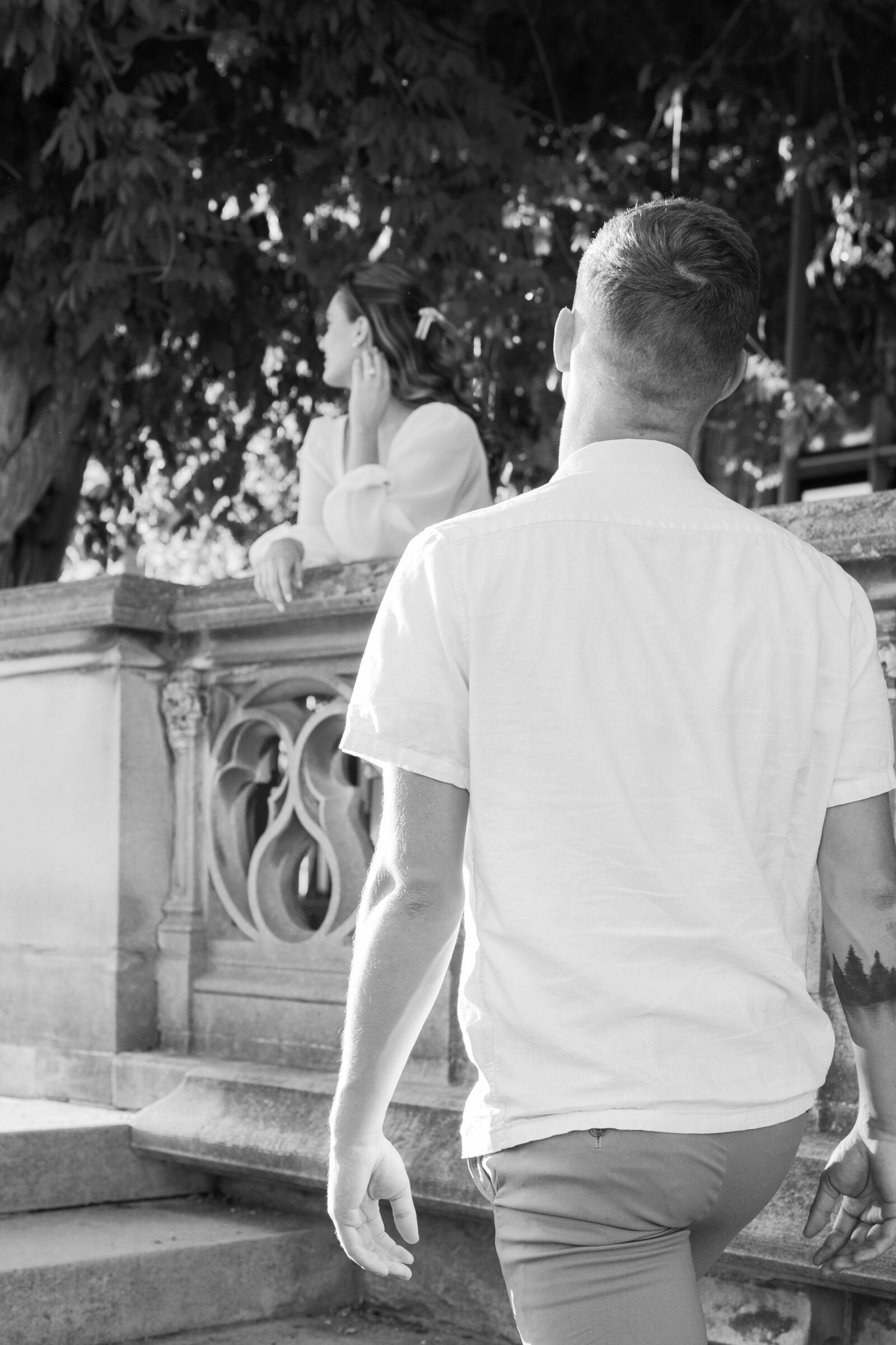 Engagement Photos at the Biltmore Estate | guy walks up stairs towards girl