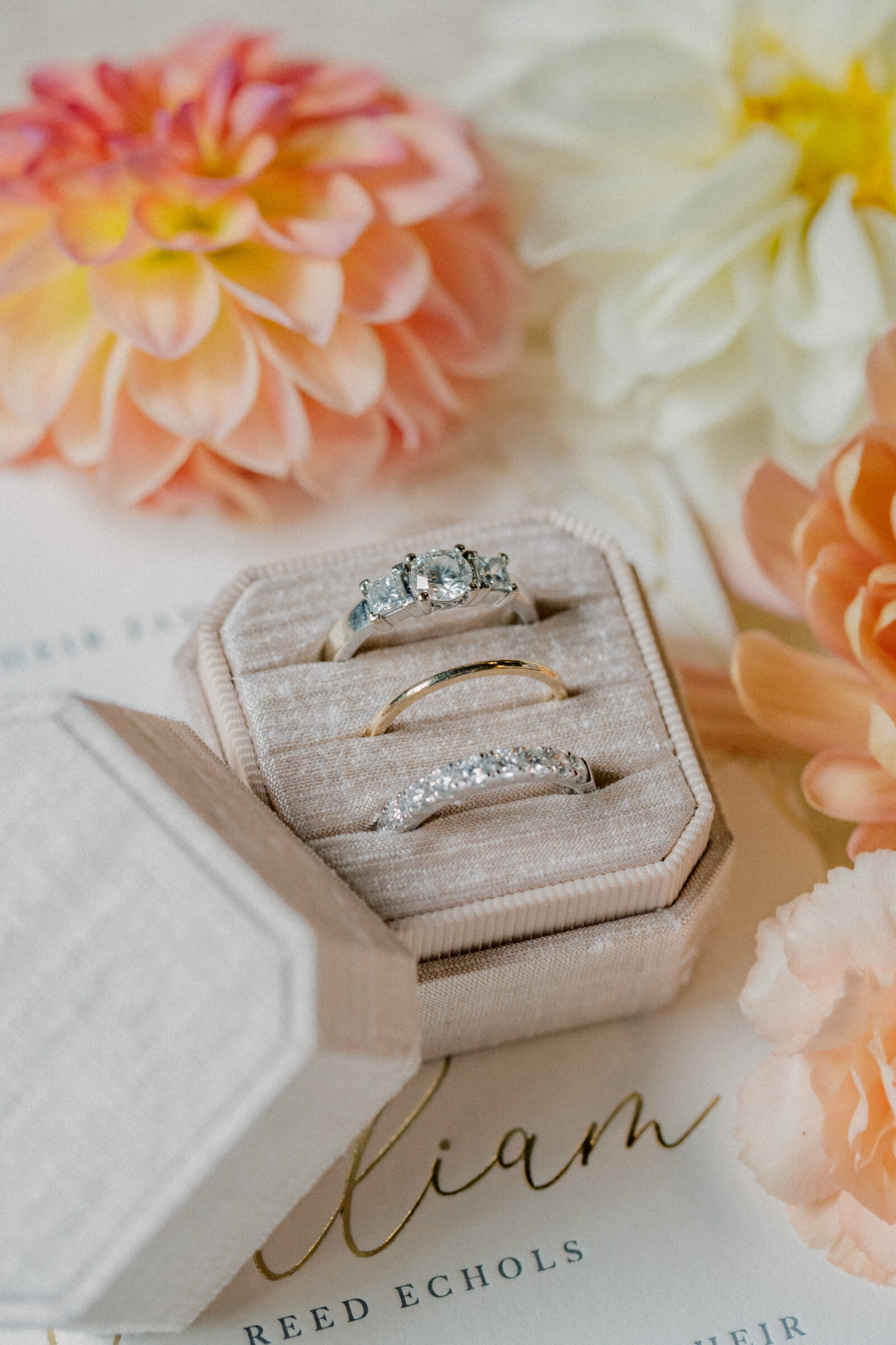 Bristol Train Station Wedding | rings in a ring box sitting on a wedding invitation with flowers