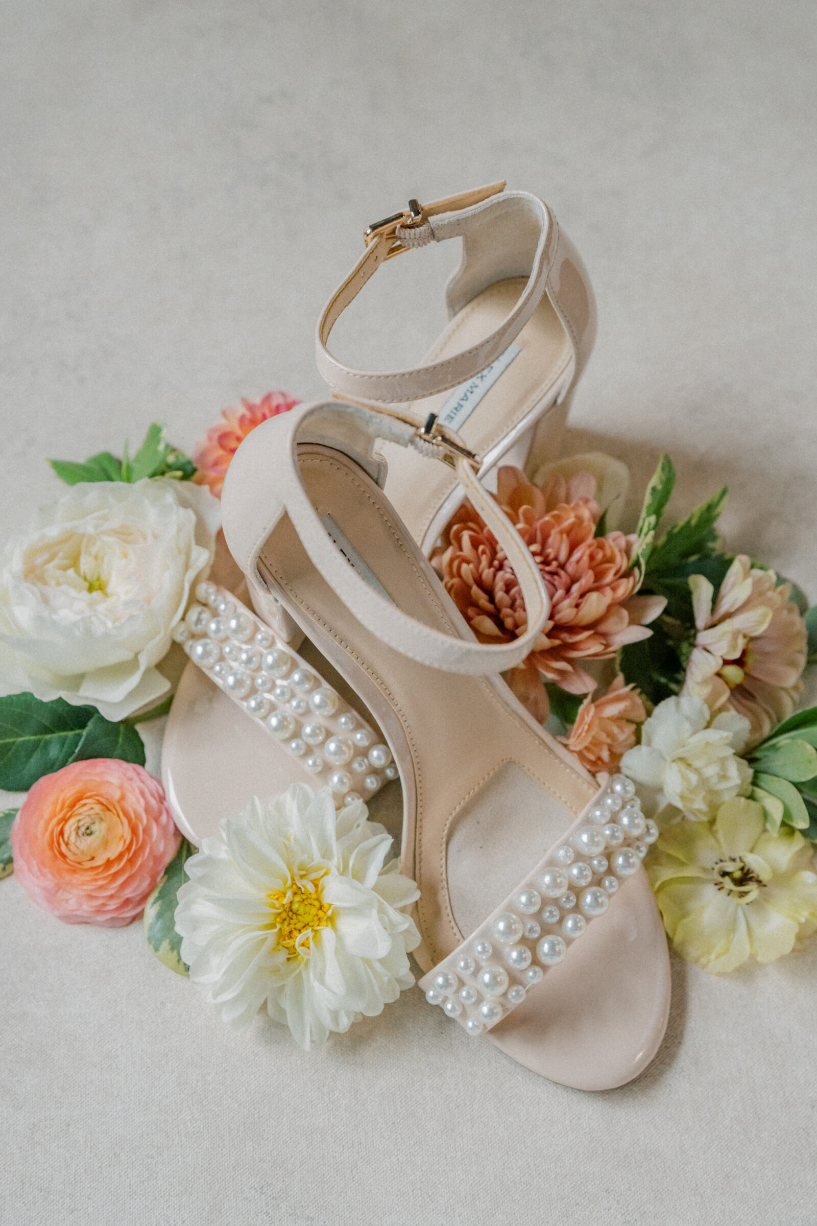 Bristol VA Wedding Photographer | pearl wedding shoes surrounded by flowers