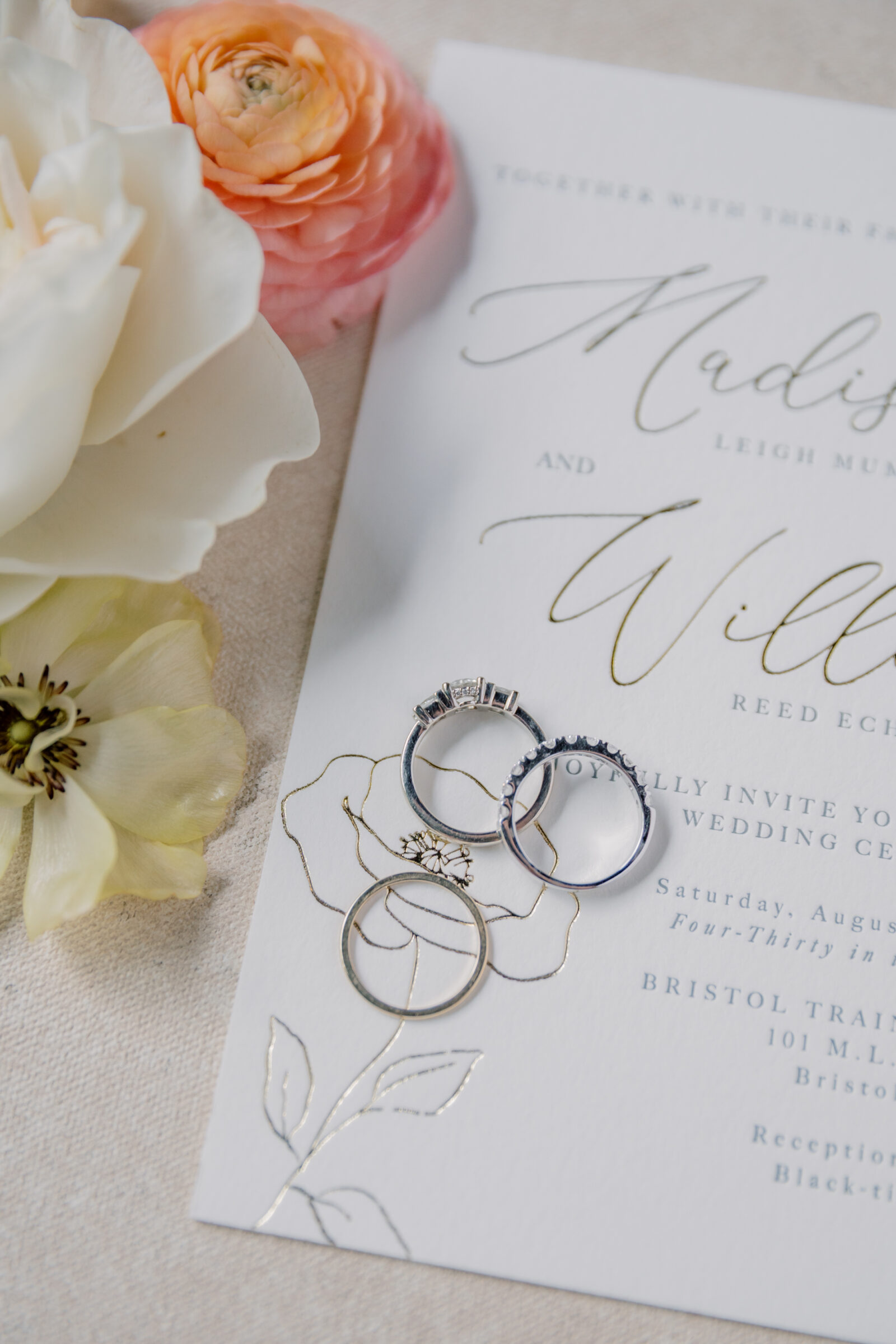 Bristol Train Station Wedding | wedding rings on an invitation