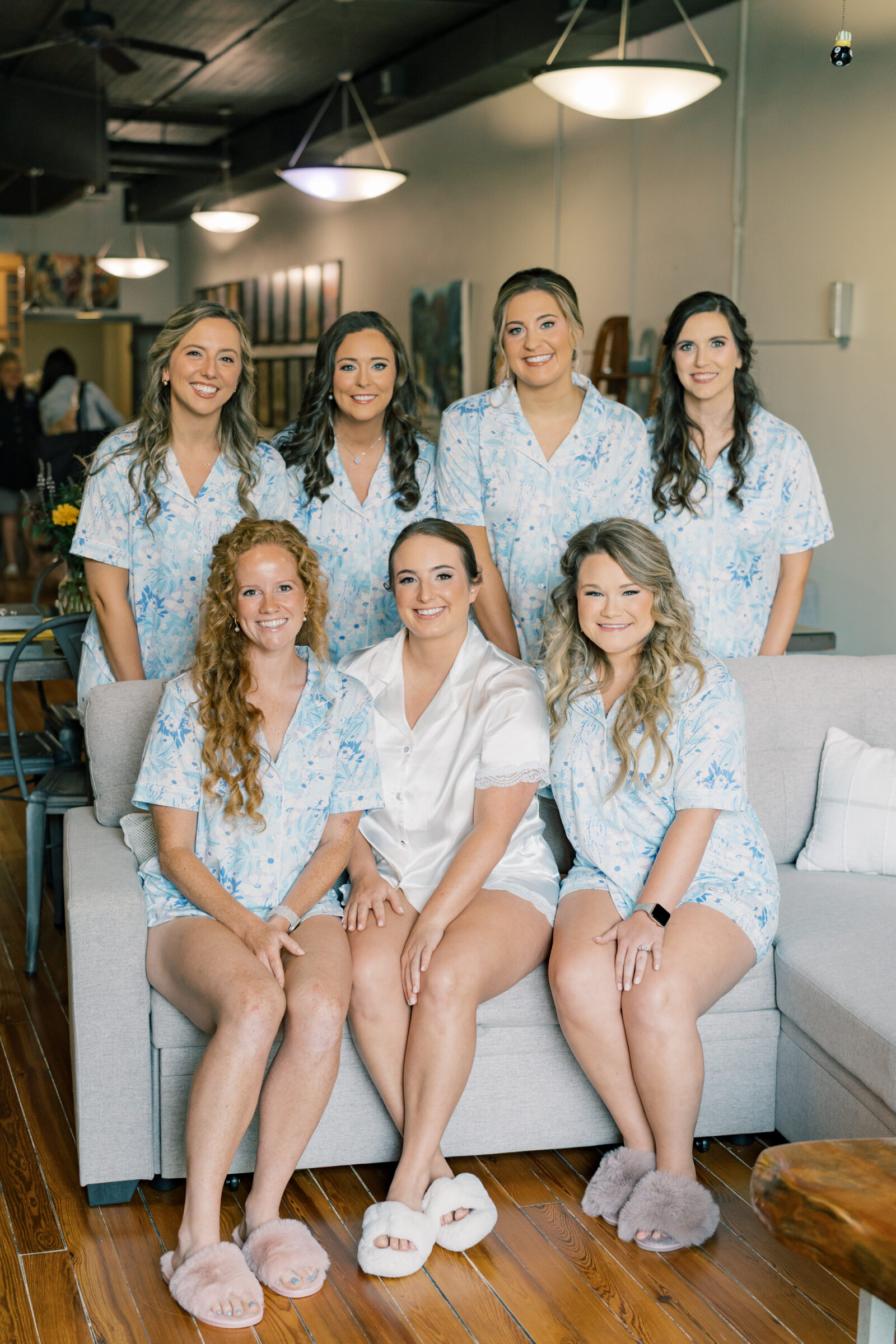 Southwest VA Wedding Photographer | bride and bridesmaids smile for picture while wearing matching floral pajamas and slippers