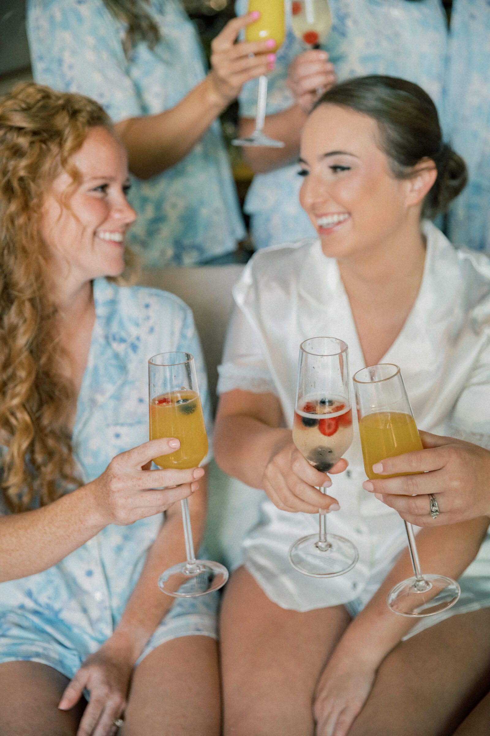 Southwest VA Wedding Photographer | bride and bridesmaids clink glasses of mimosas