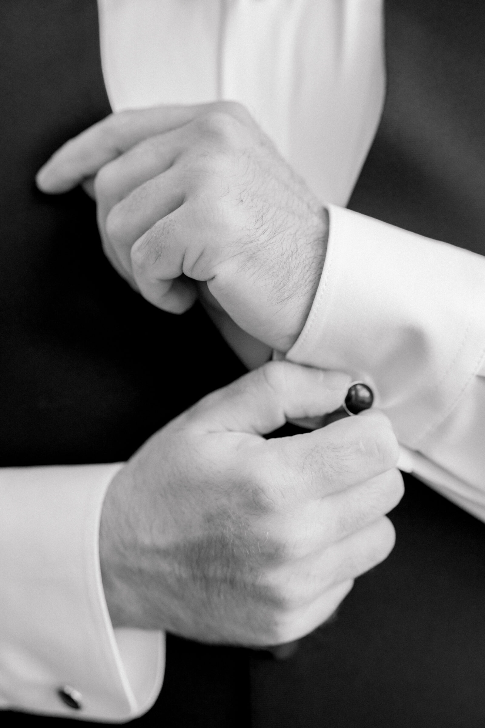 Bristol Hotel Wedding | groom adjusts cufflinks