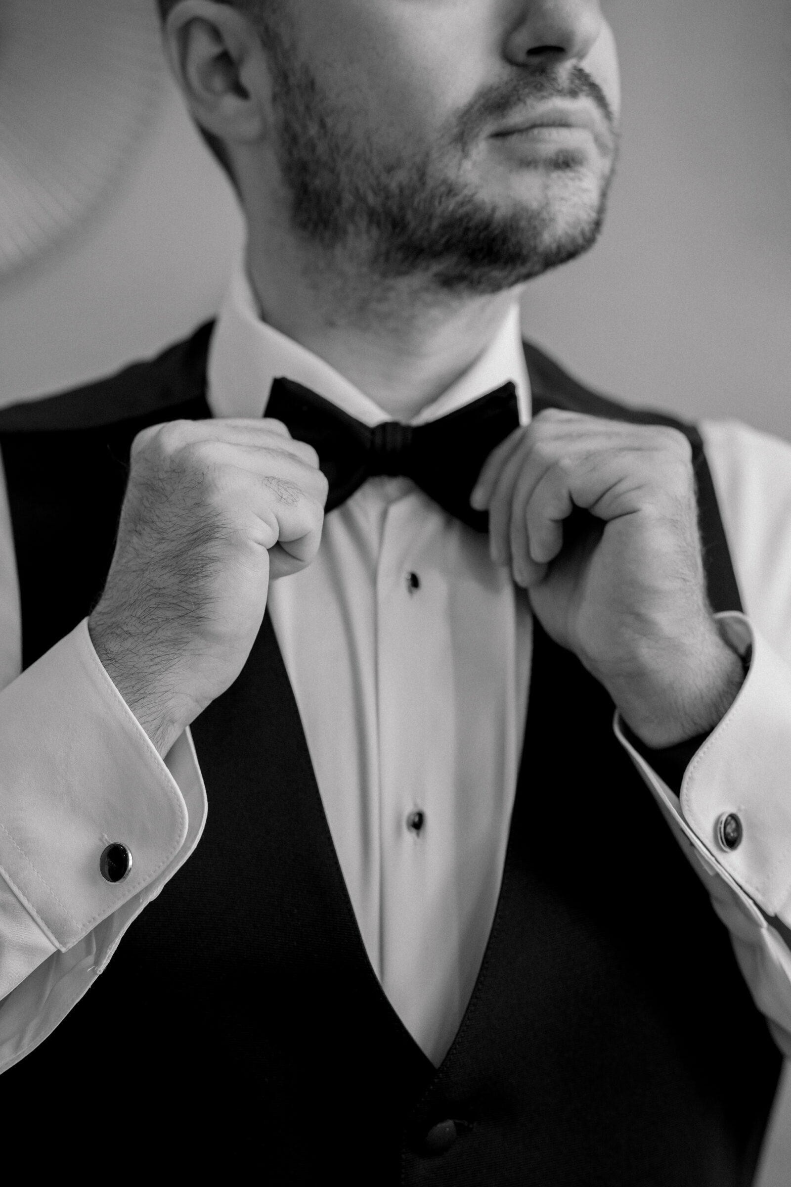 Bristol Hotel Wedding | groom adjusts tie