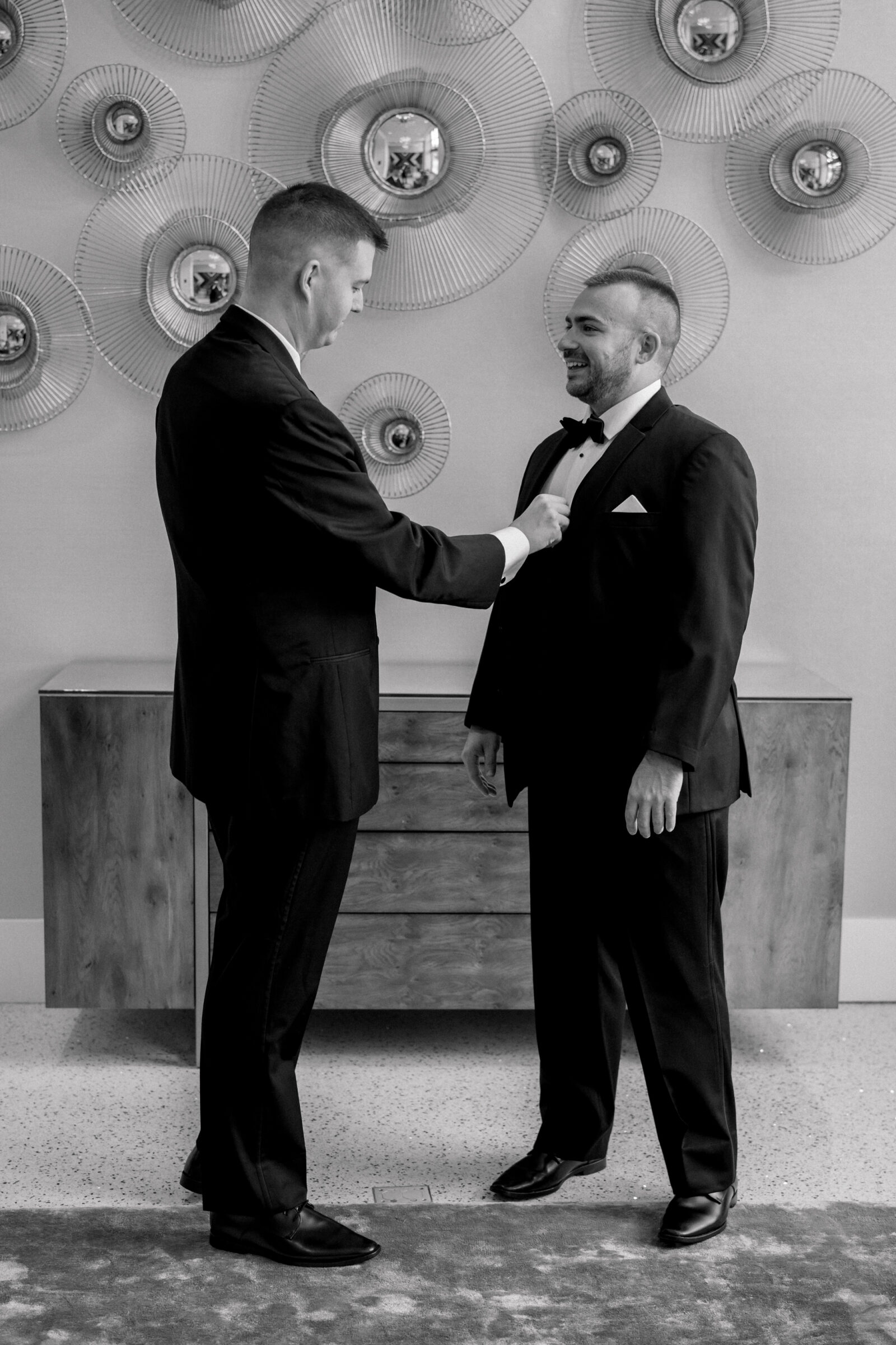Bristol Hotel Wedding | best man helps groom with jacket