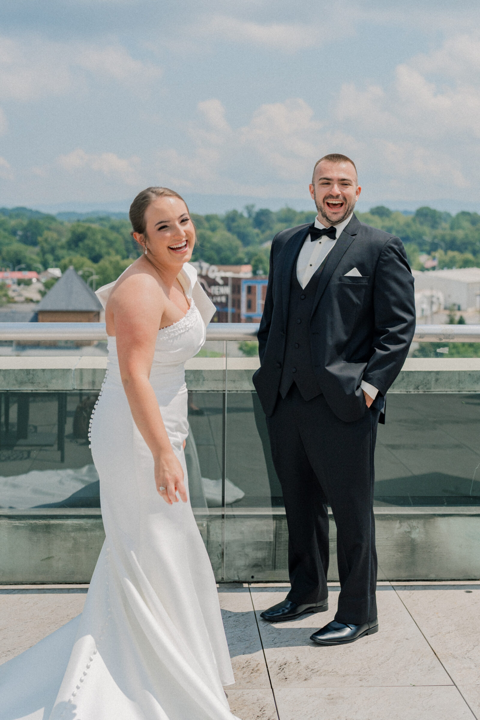 Bristol Hotel Wedding | bride and groom laugh during rooftop first look