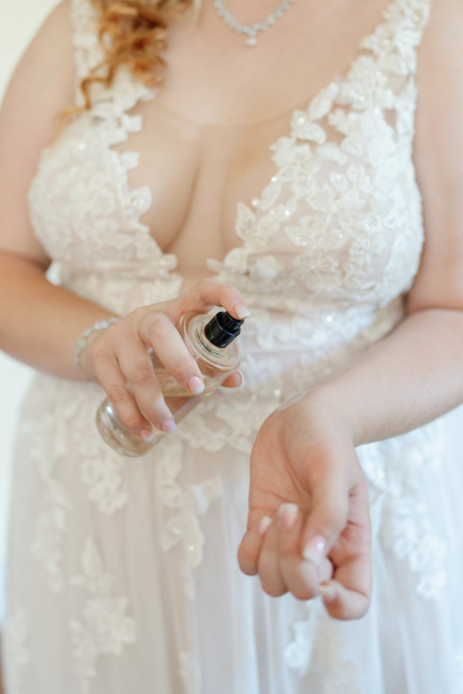 Full Bloom Farm Wedding | bride spraying perfume before wedding