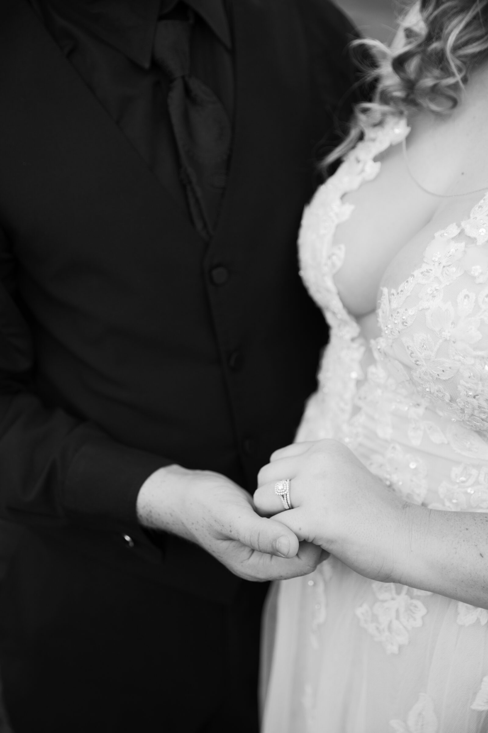 Full Bloom Farm Wedding | black and white image of engagement and wedding rings on bride's hand