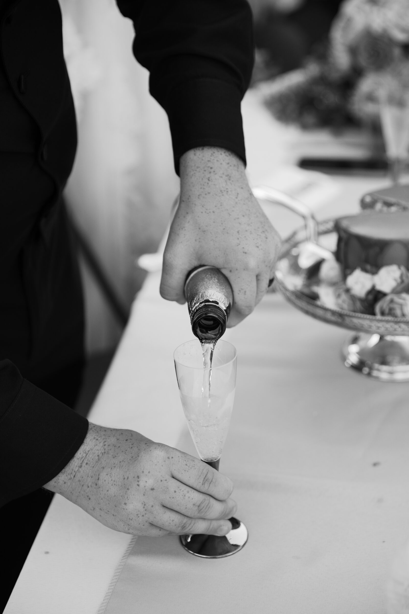 Abingdon VA Wedding Photographer | groom pours drink