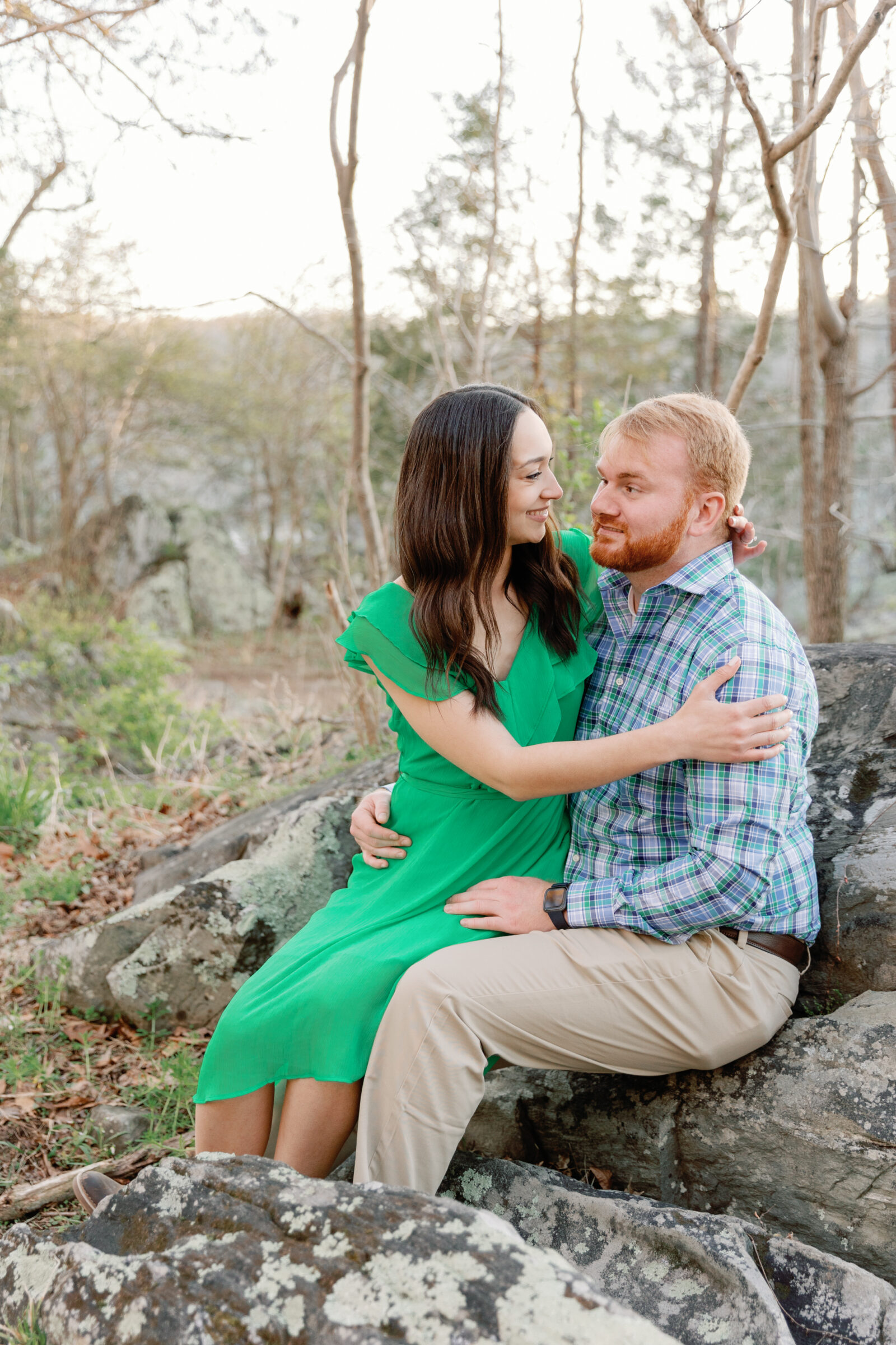 Engagement Session at Great Falls Park in Maryland | couple sitting on a rock
